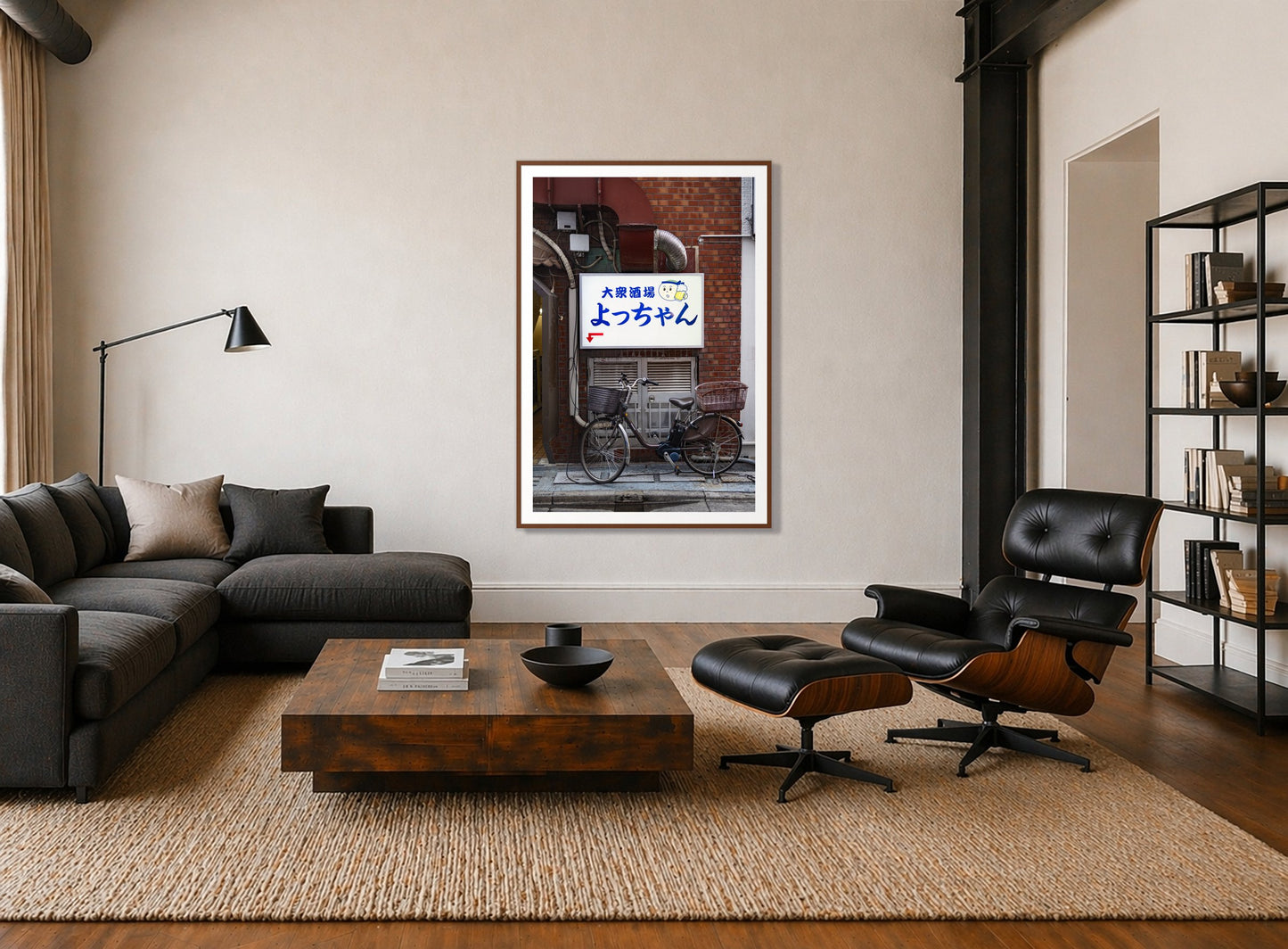 Invite Only by Dylan Ozanich in a Walnut frame, above a dark sectional in a loft with a black leather lounge chair