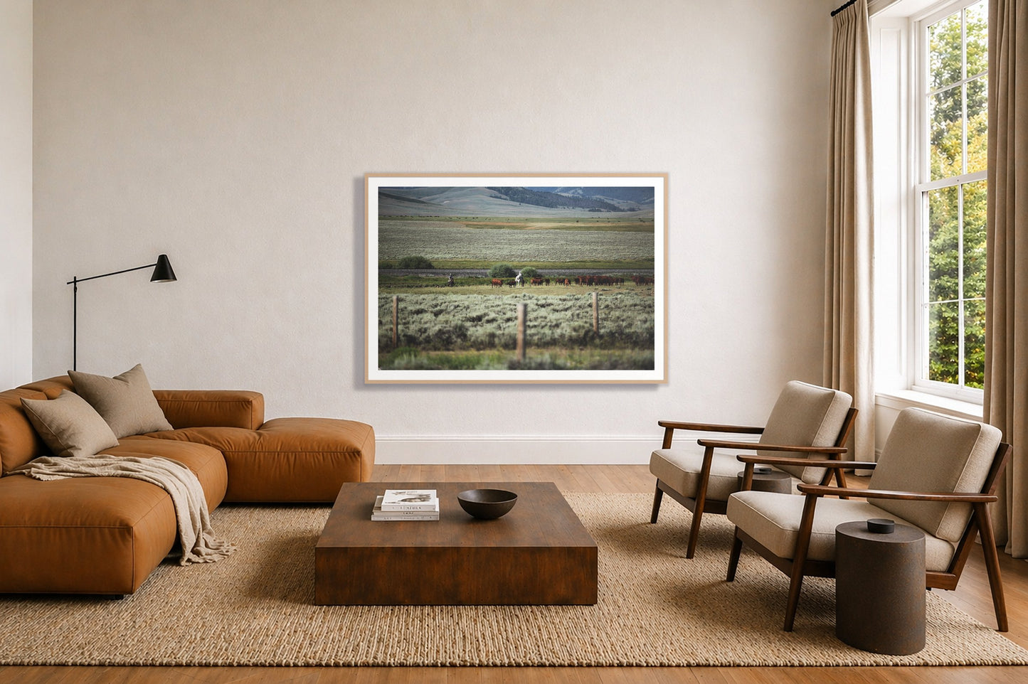 Montana by Dylan Ozanich in an Oak frame, above a tan modular leather sofa in a minimal, sunlit living room