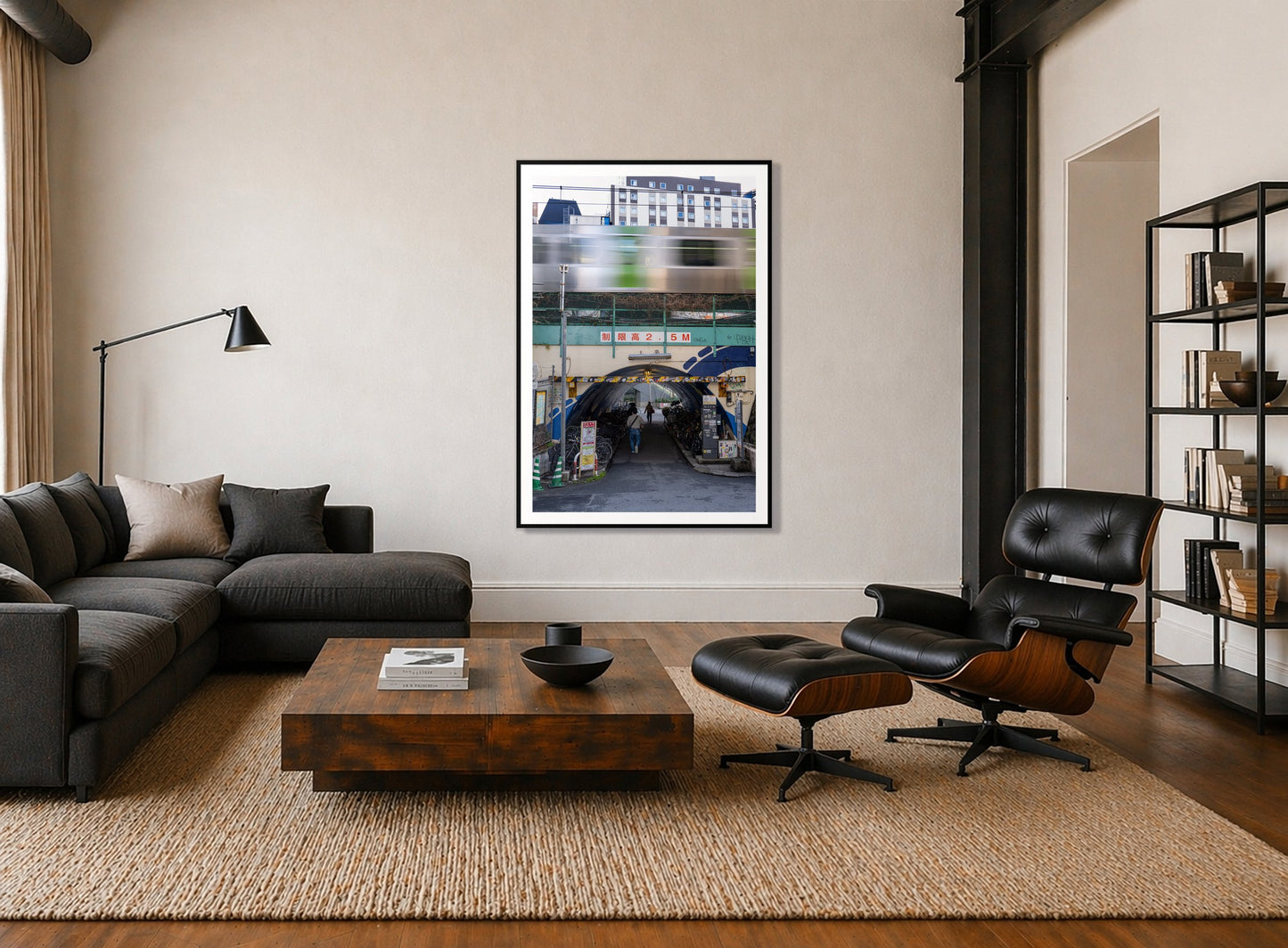 Tokyo Bustle by Dylan Ozanich in a Black frame, above a dark sectional in a loft with a black leather lounge chair