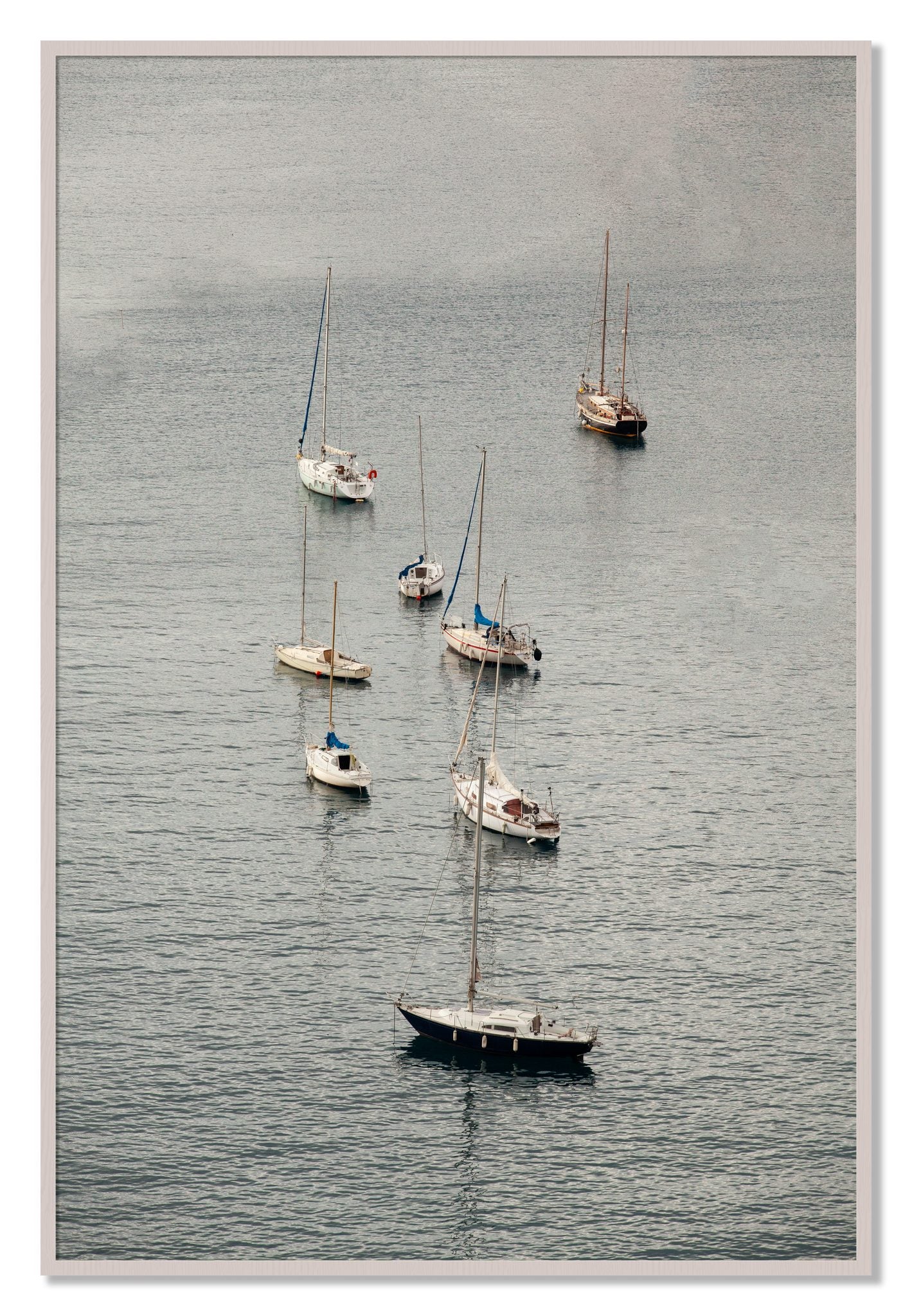 Framed photograph of Anchored by Dylan Ozanich, White Maple frame, Full Bleed