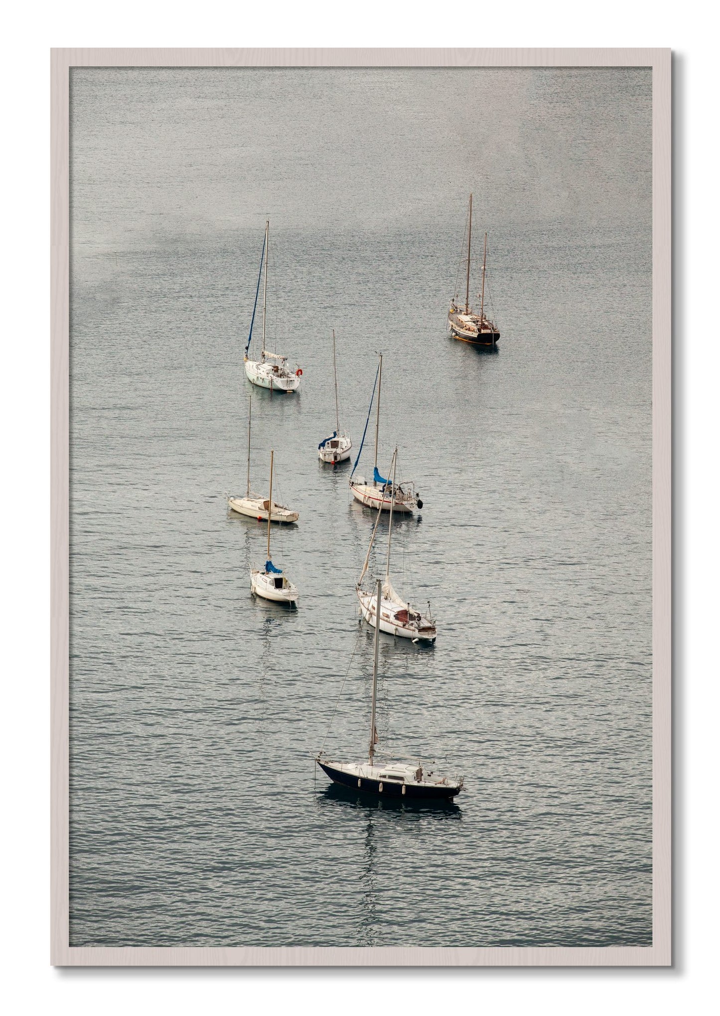 Framed photograph of Anchored by Dylan Ozanich, White Maple frame, Full Bleed