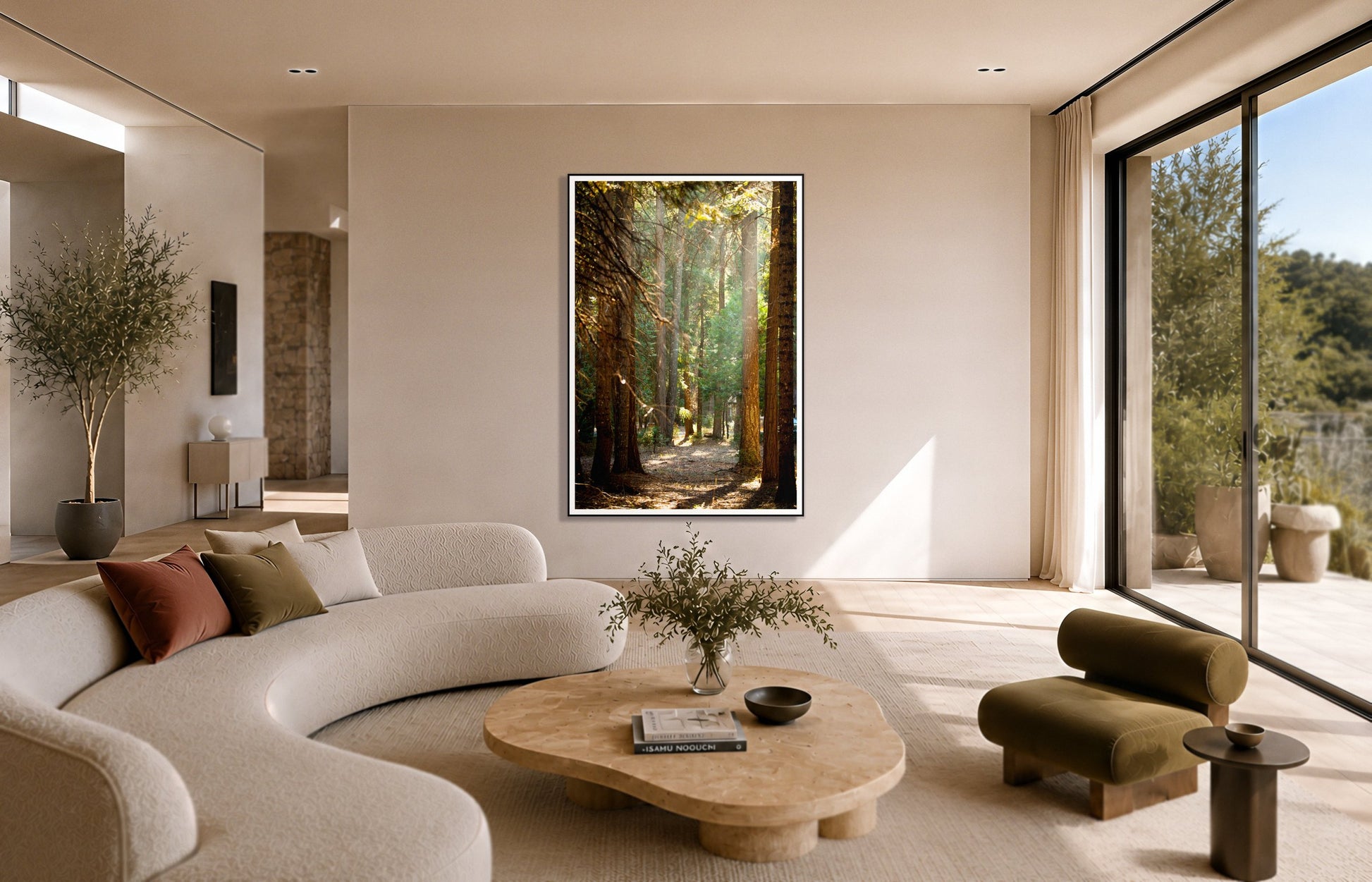 Autumn by Dylan Ozanich in a Black frame, above a cream curved sofa in a sunlit room with olive velvet seating
