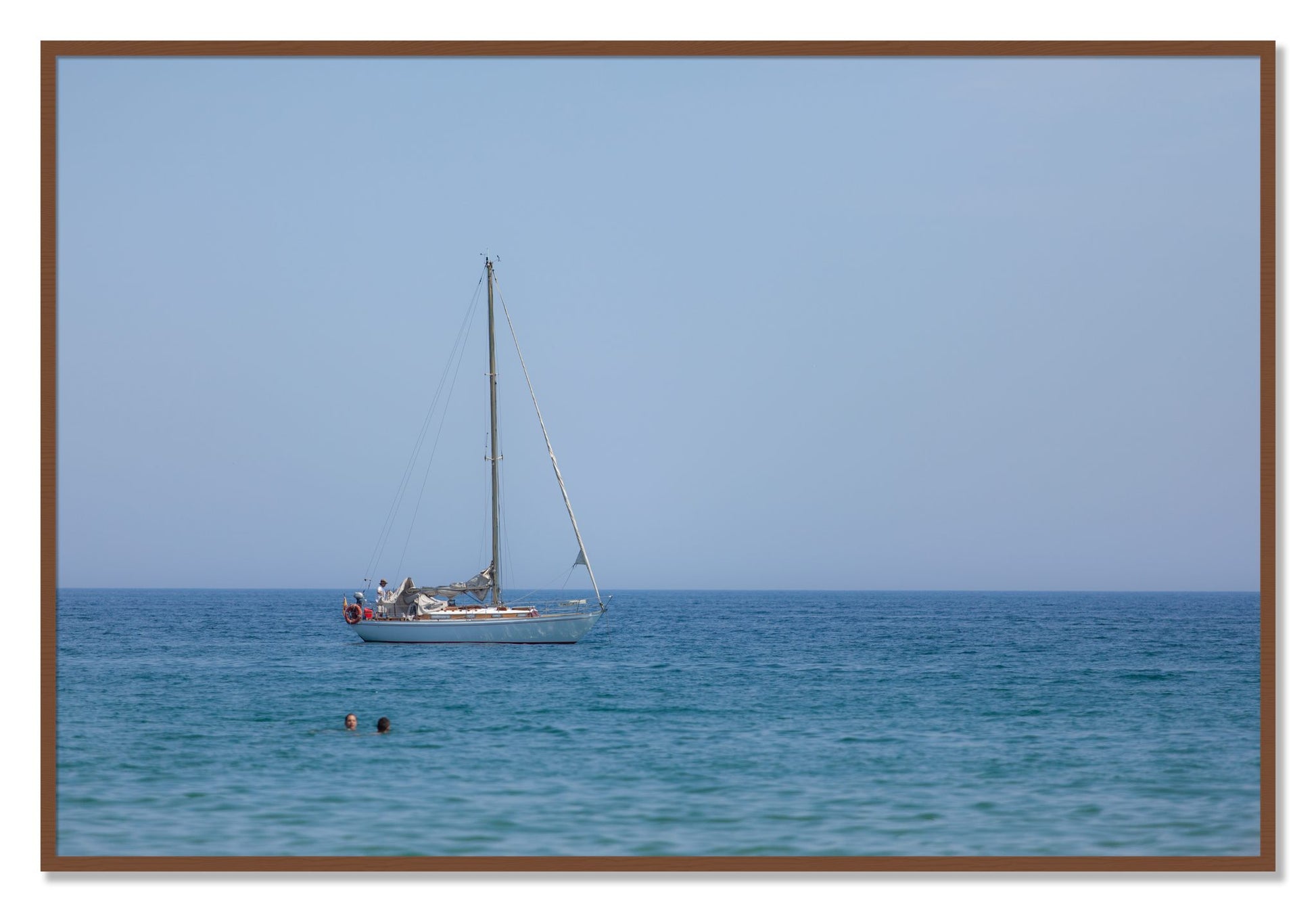 Framed photograph of Barcelona Sea by Dylan Ozanich, Walnut frame, Full Bleed