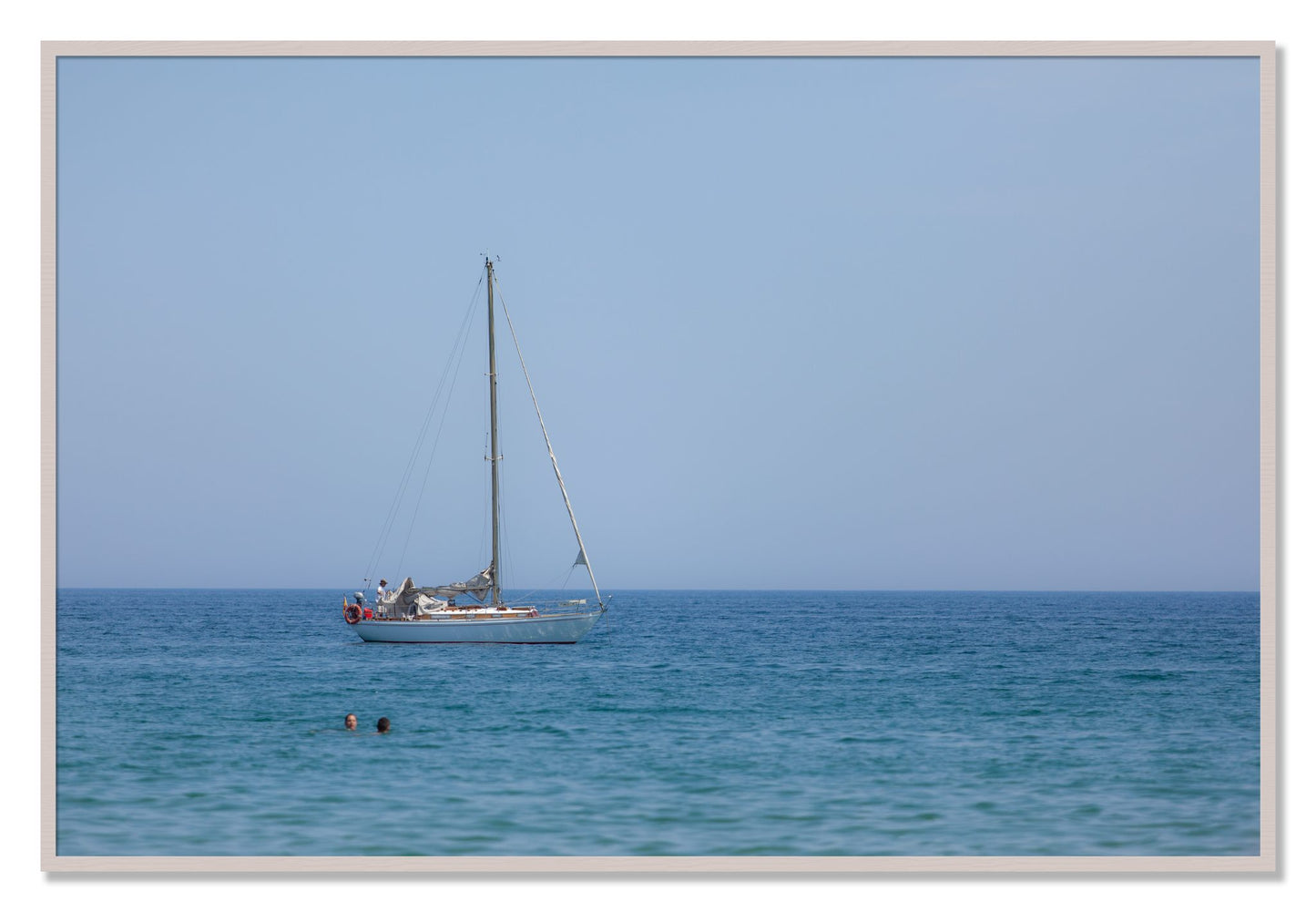 Framed photograph of Barcelona Sea by Dylan Ozanich, White Maple frame, Full Bleed