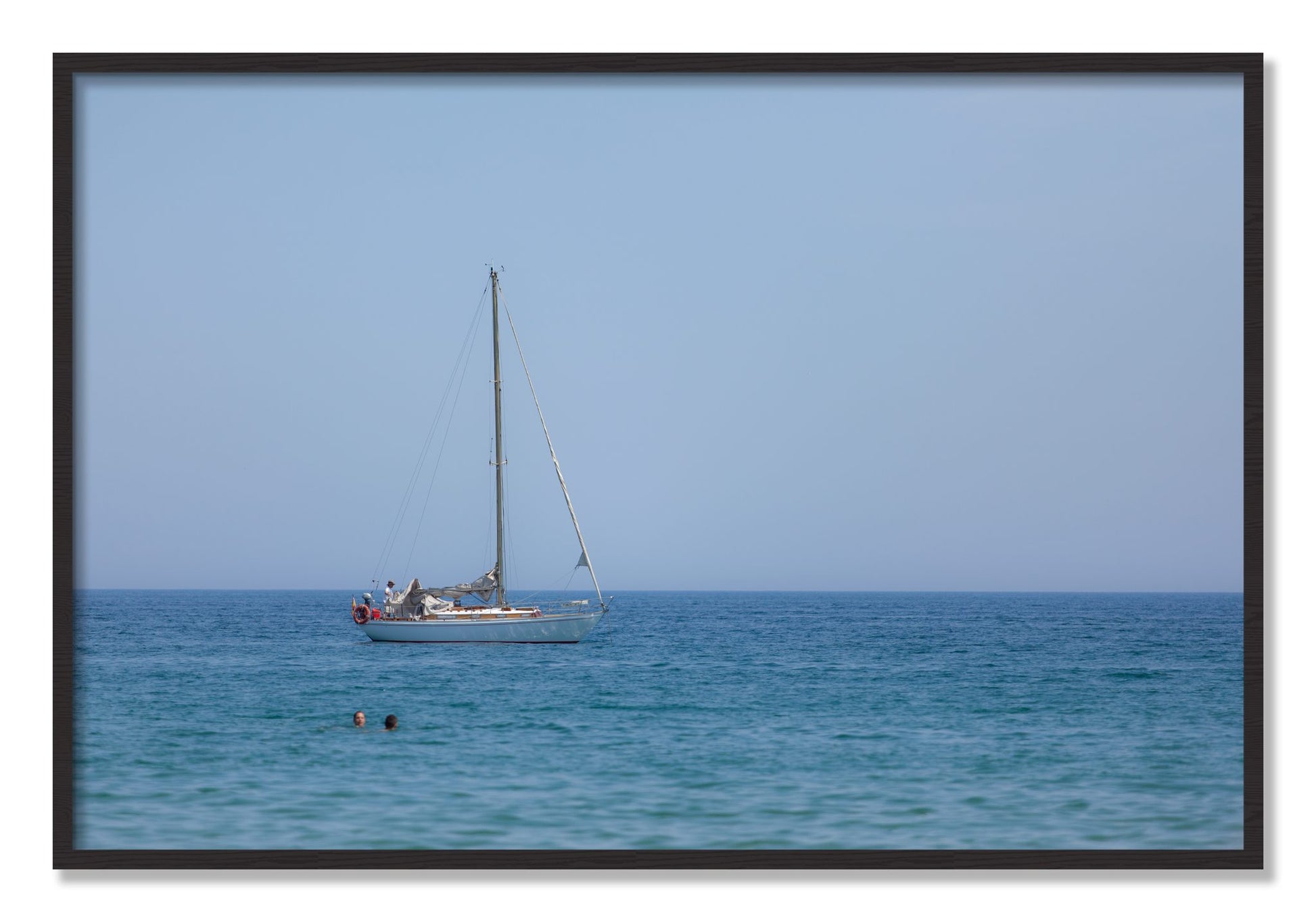 Framed photograph of Barcelona Sea by Dylan Ozanich, Black Walnut frame, Full Bleed
