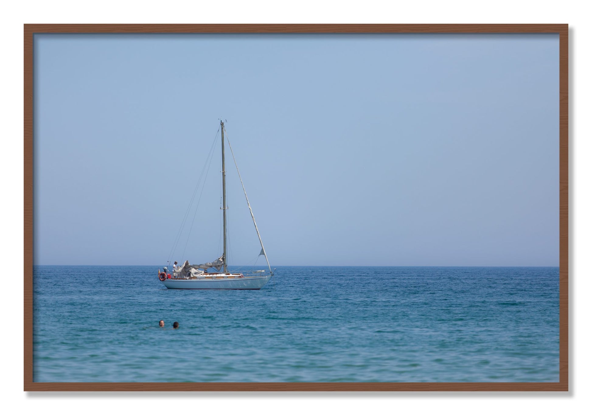 Framed photograph of Barcelona Sea by Dylan Ozanich, Walnut frame, Full Bleed