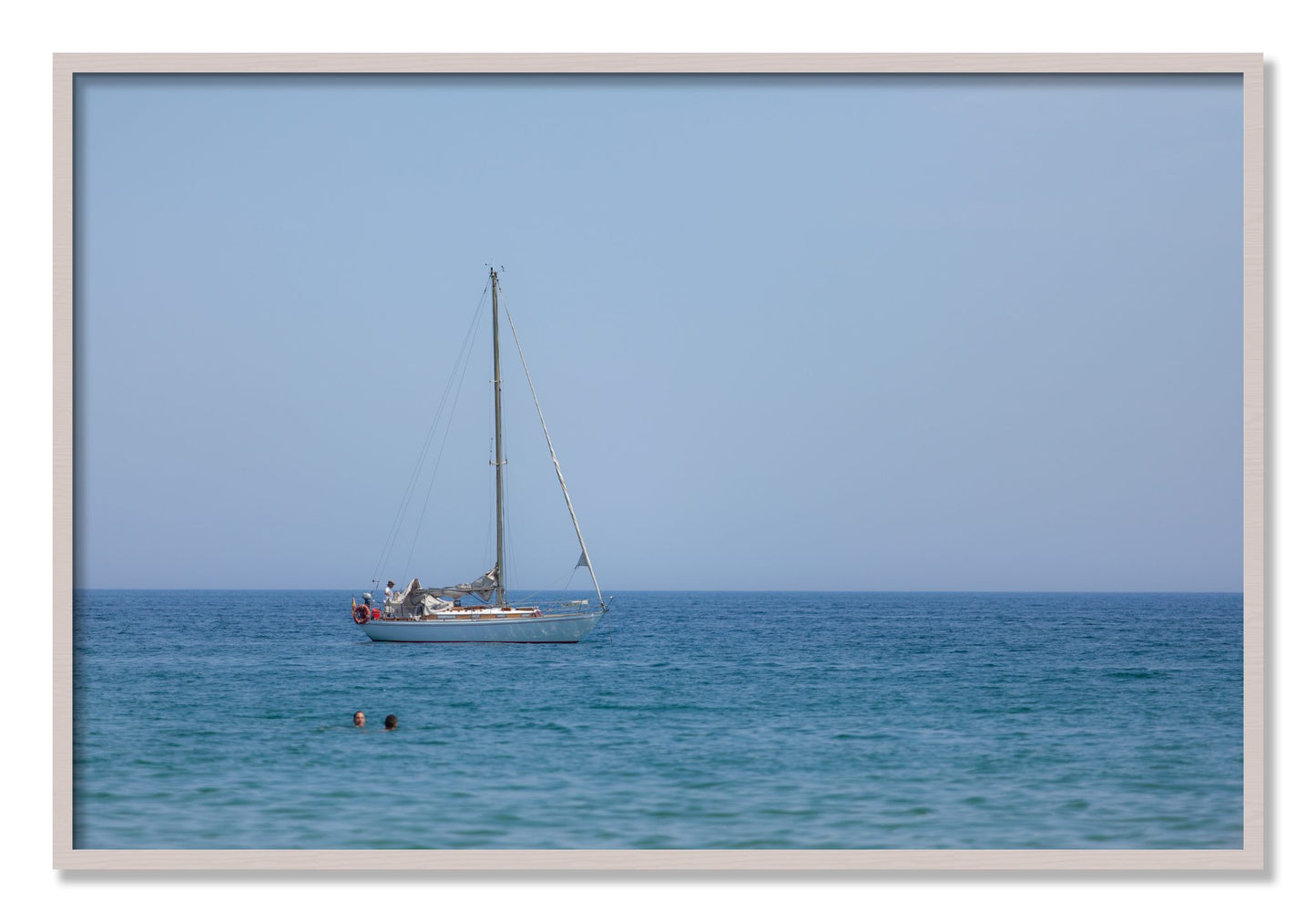 Framed photograph of Barcelona Sea by Dylan Ozanich, White Maple frame, Full Bleed