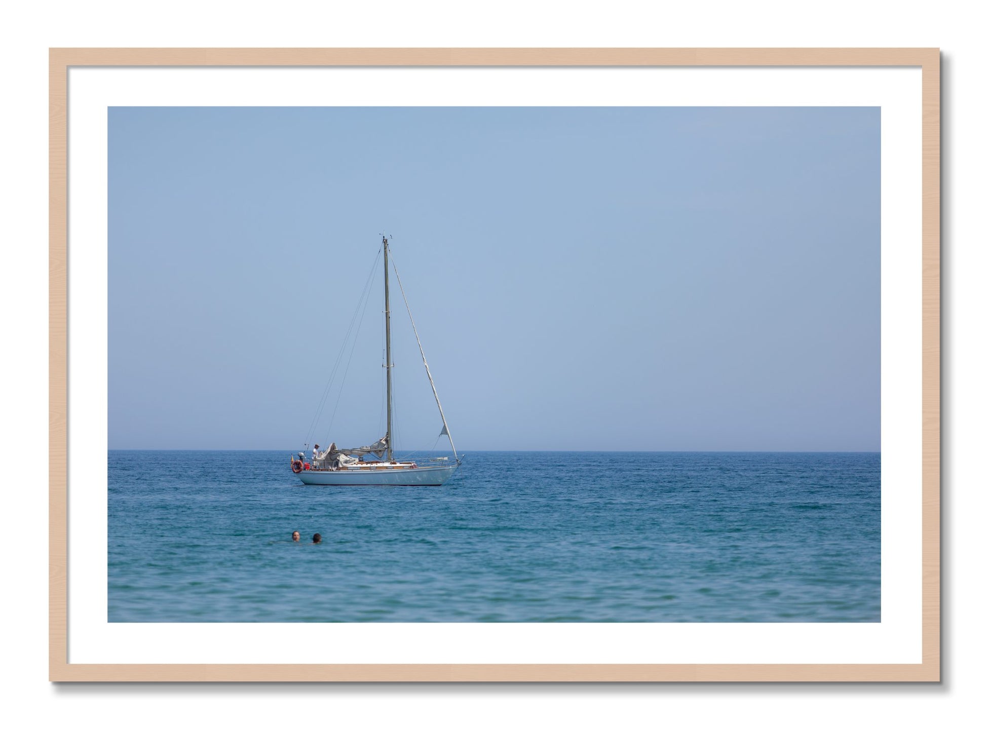Framed photograph of Barcelona Sea by Dylan Ozanich, Maple frame, Borders