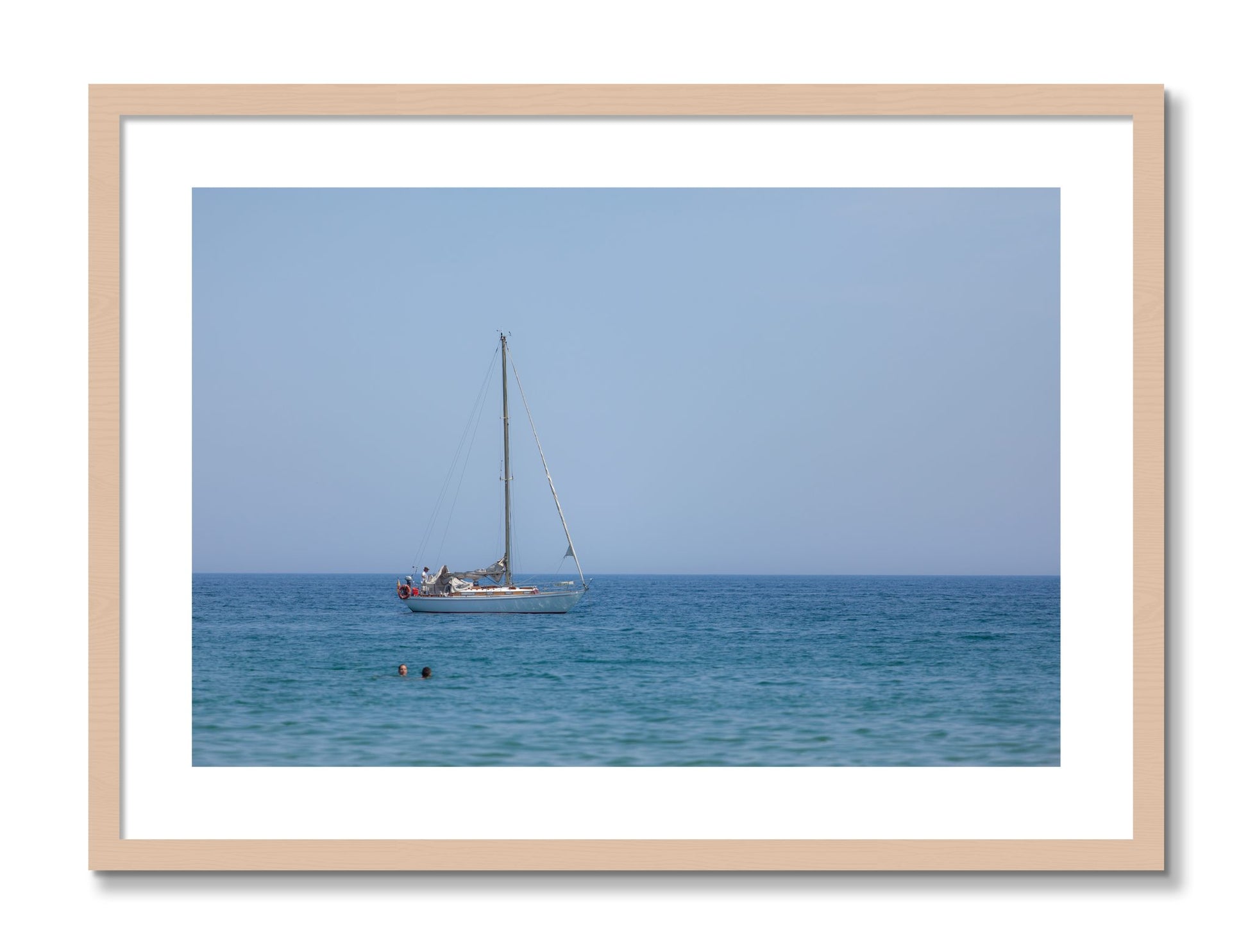 Framed photograph of Barcelona Sea by Dylan Ozanich, Maple frame, Borders