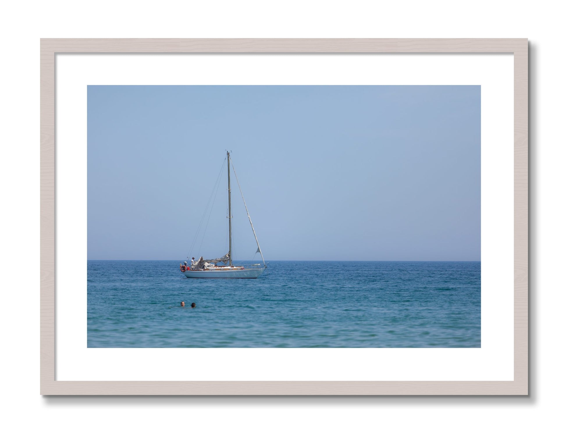 Framed photograph of Barcelona Sea by Dylan Ozanich, White Maple frame, Borders