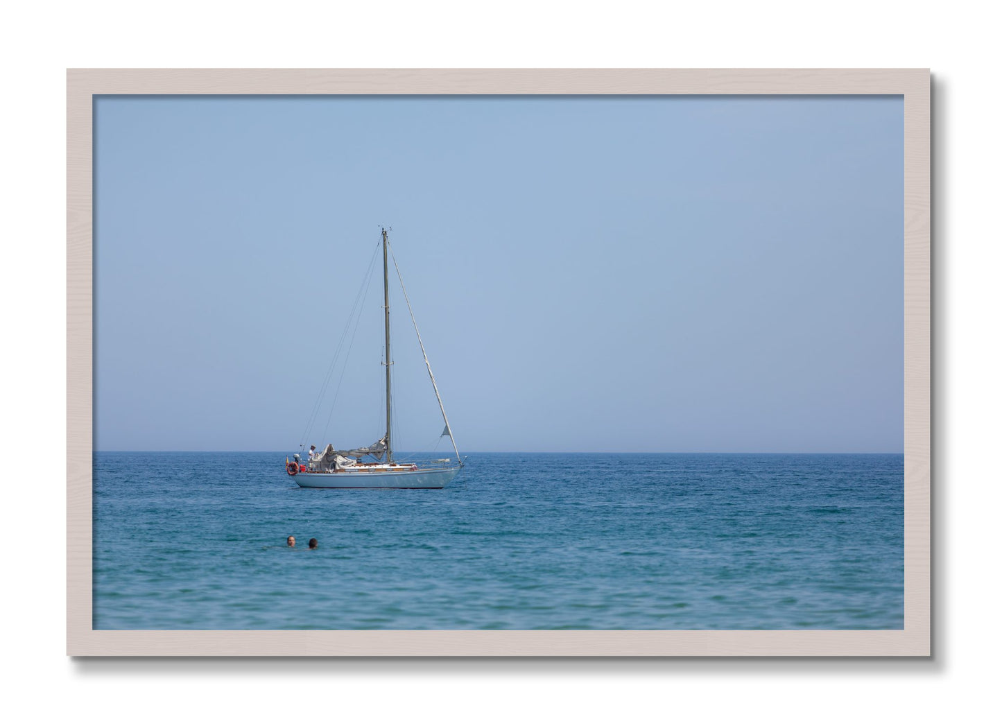 Framed photograph of Barcelona Sea by Dylan Ozanich, White Maple frame, Full Bleed