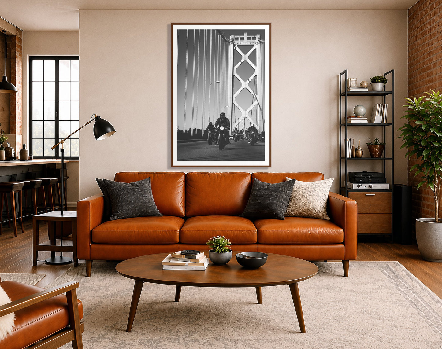 Bay Bridge Boys by Dylan Ozanich in a Walnut frame, above a cognac leather sofa in a brick loft