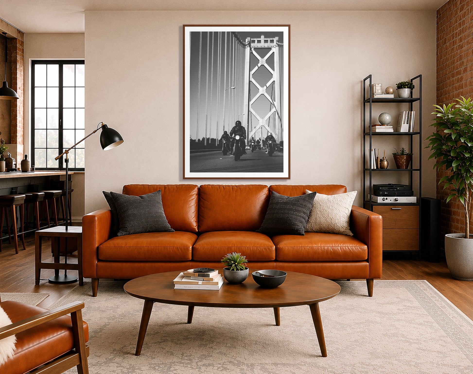 Bay Bridge Boys by Dylan Ozanich in a Walnut frame, above a cognac leather sofa in a brick loft