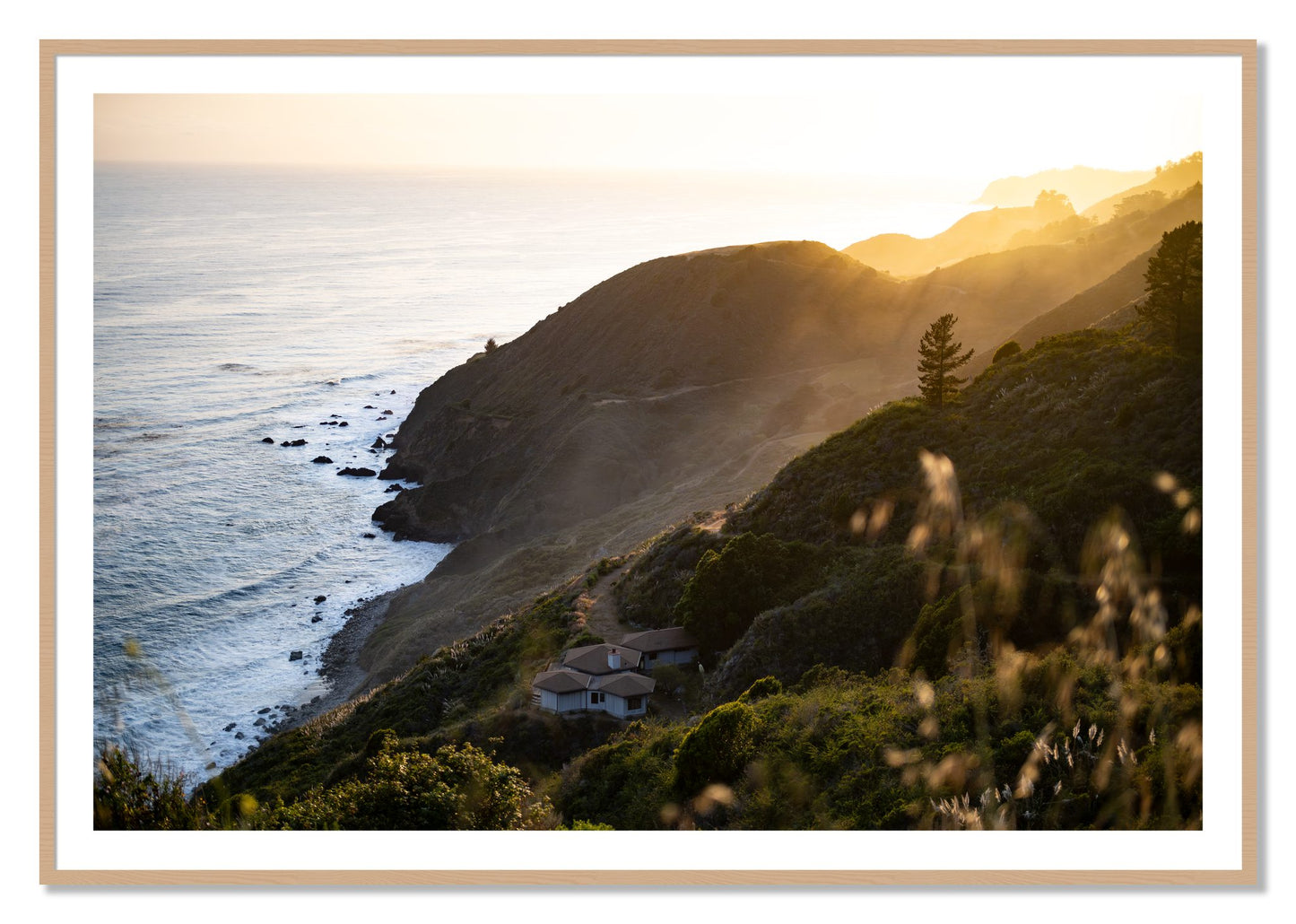 Framed photograph of Big Sur Sunset by Dylan Ozanich, Oak frame, Borders
