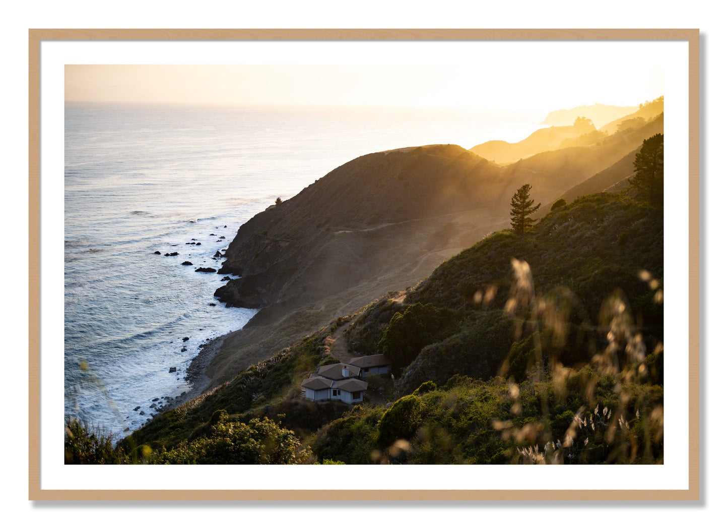 Framed photograph of Big Sur Sunset by Dylan Ozanich, Oak frame, Borders