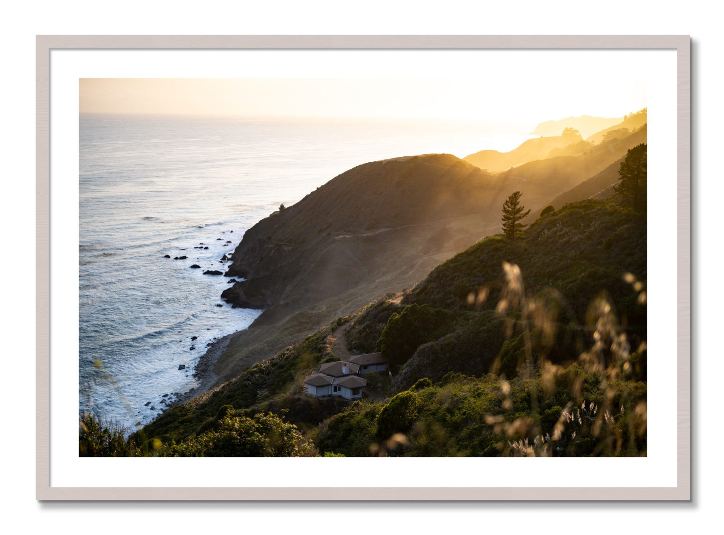 Framed photograph of Big Sur Sunset by Dylan Ozanich, White Maple frame, Borders