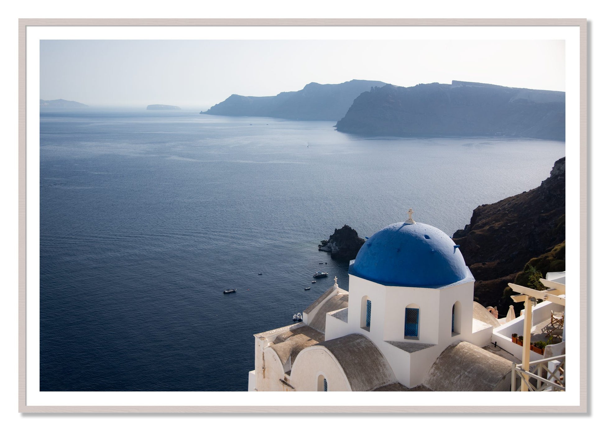 Blue Cap by Dylan Ozanich, 48×72 print with a White Border in a White Maple frame