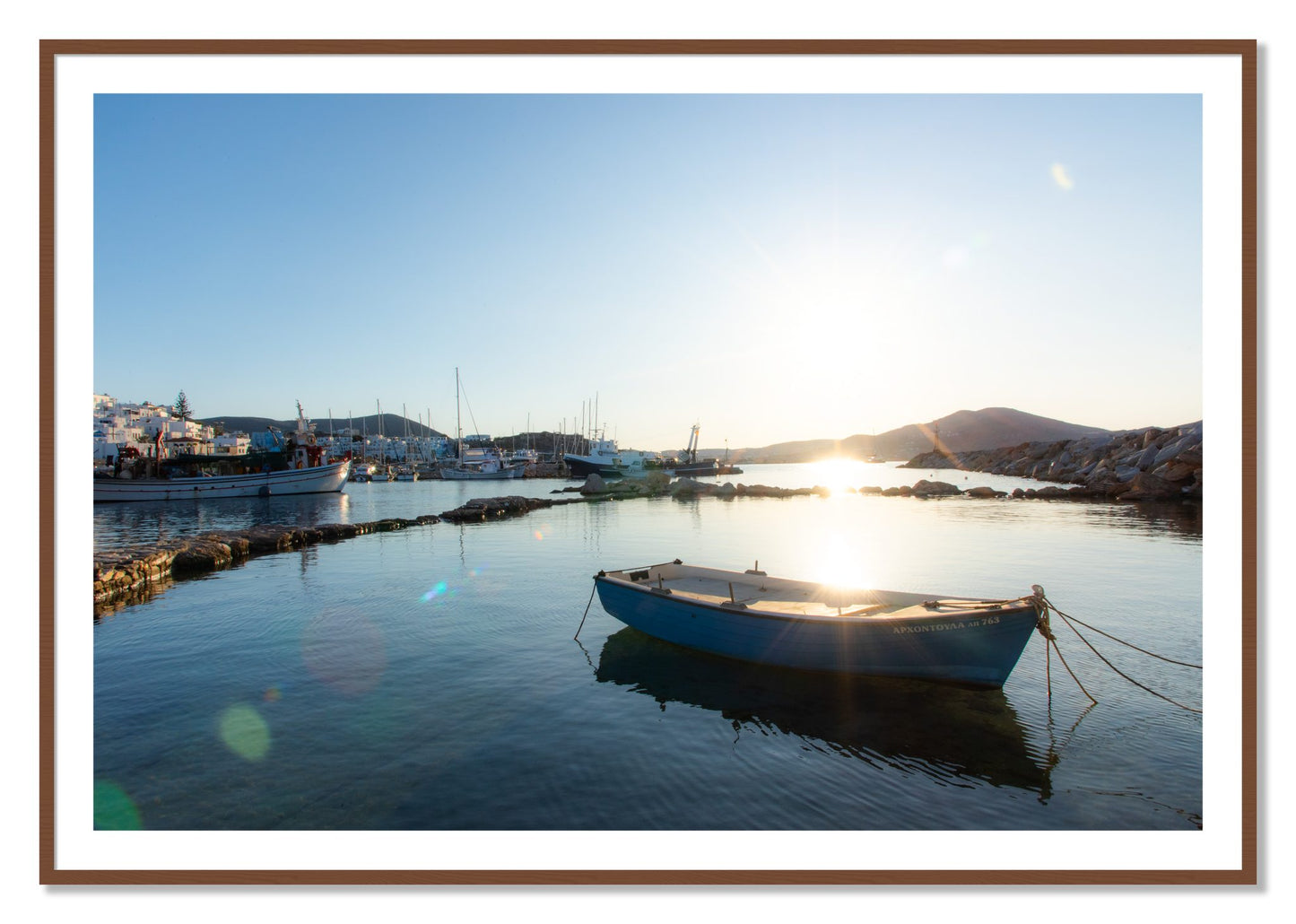 Framed photograph of Boat In Paros by Dylan Ozanich, Walnut frame, Borders