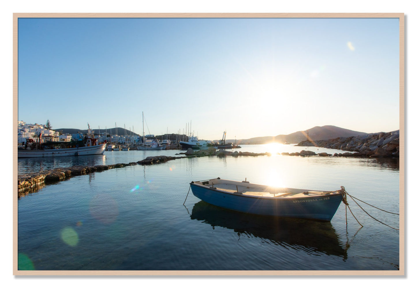 Framed photograph of Boat In Paros by Dylan Ozanich, Maple frame, Full Bleed