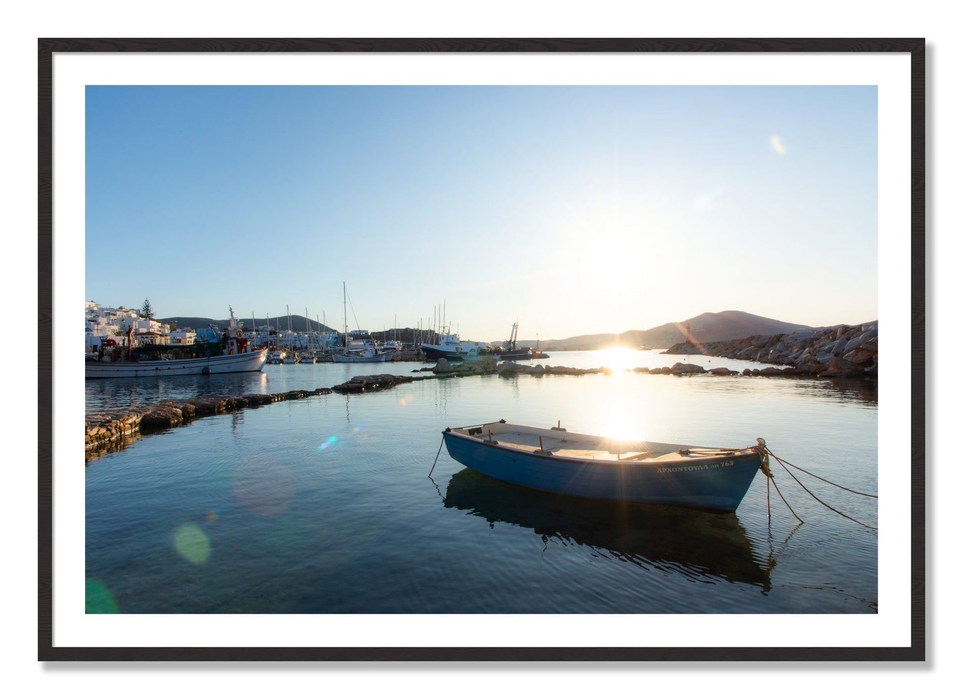 Framed photograph of Boat In Paros by Dylan Ozanich, Black Walnut frame, Borders