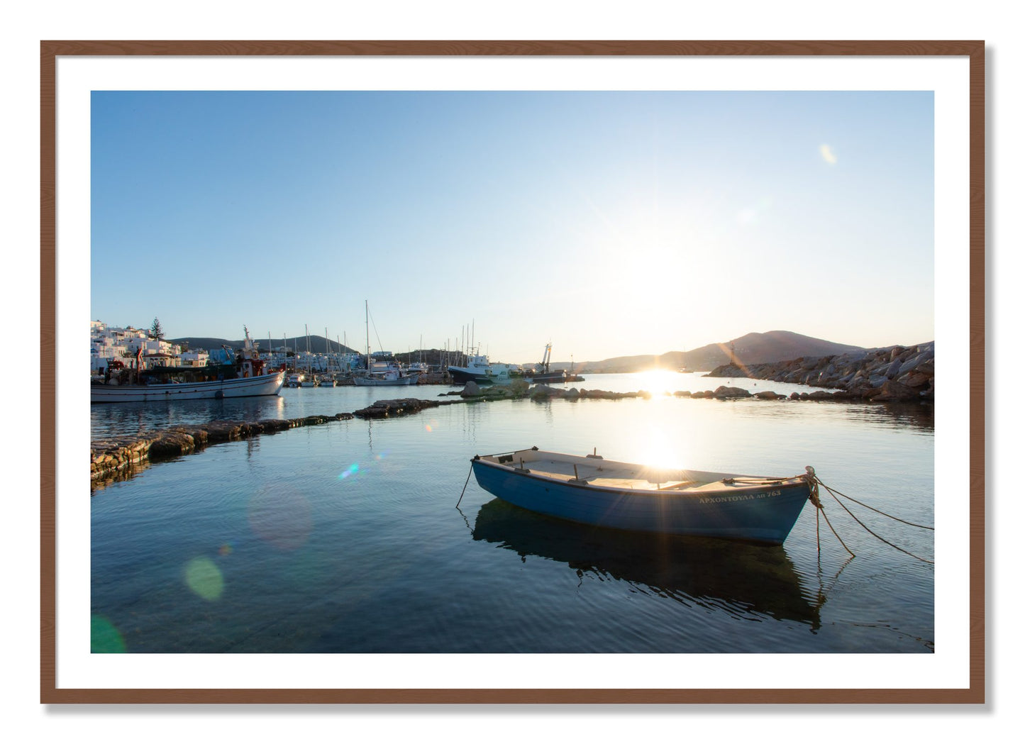 Framed photograph of Boat In Paros by Dylan Ozanich, Walnut frame, Borders