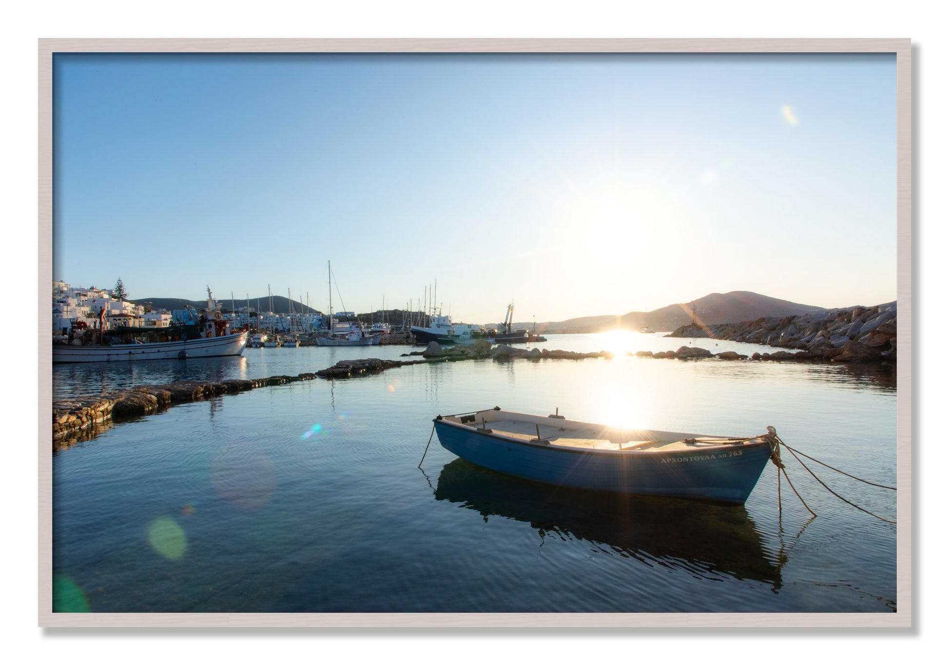 Framed photograph of Boat In Paros by Dylan Ozanich, White Maple frame, Full Bleed