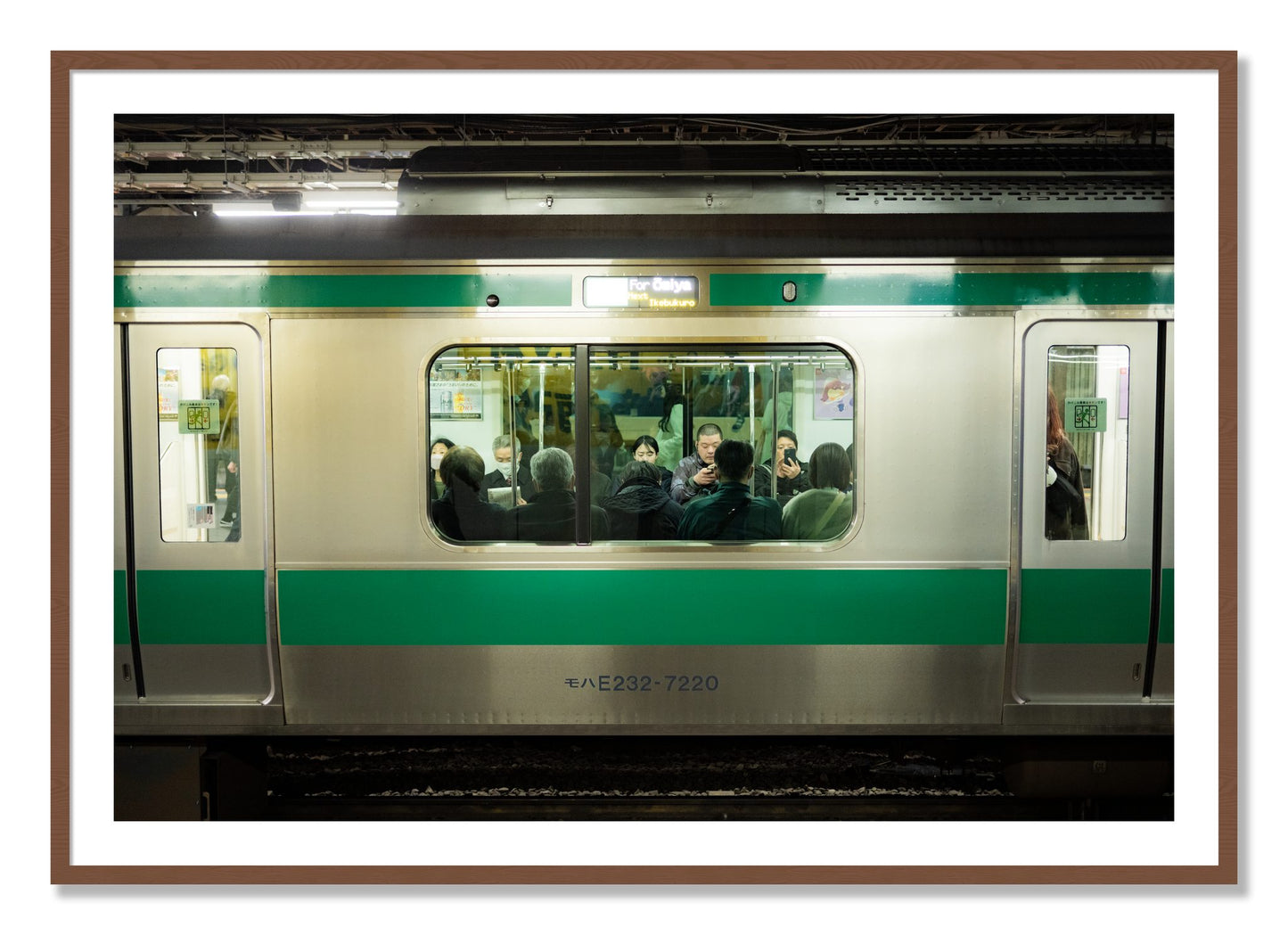 Framed photograph of Commute by Dylan Ozanich, Walnut frame, Borders
