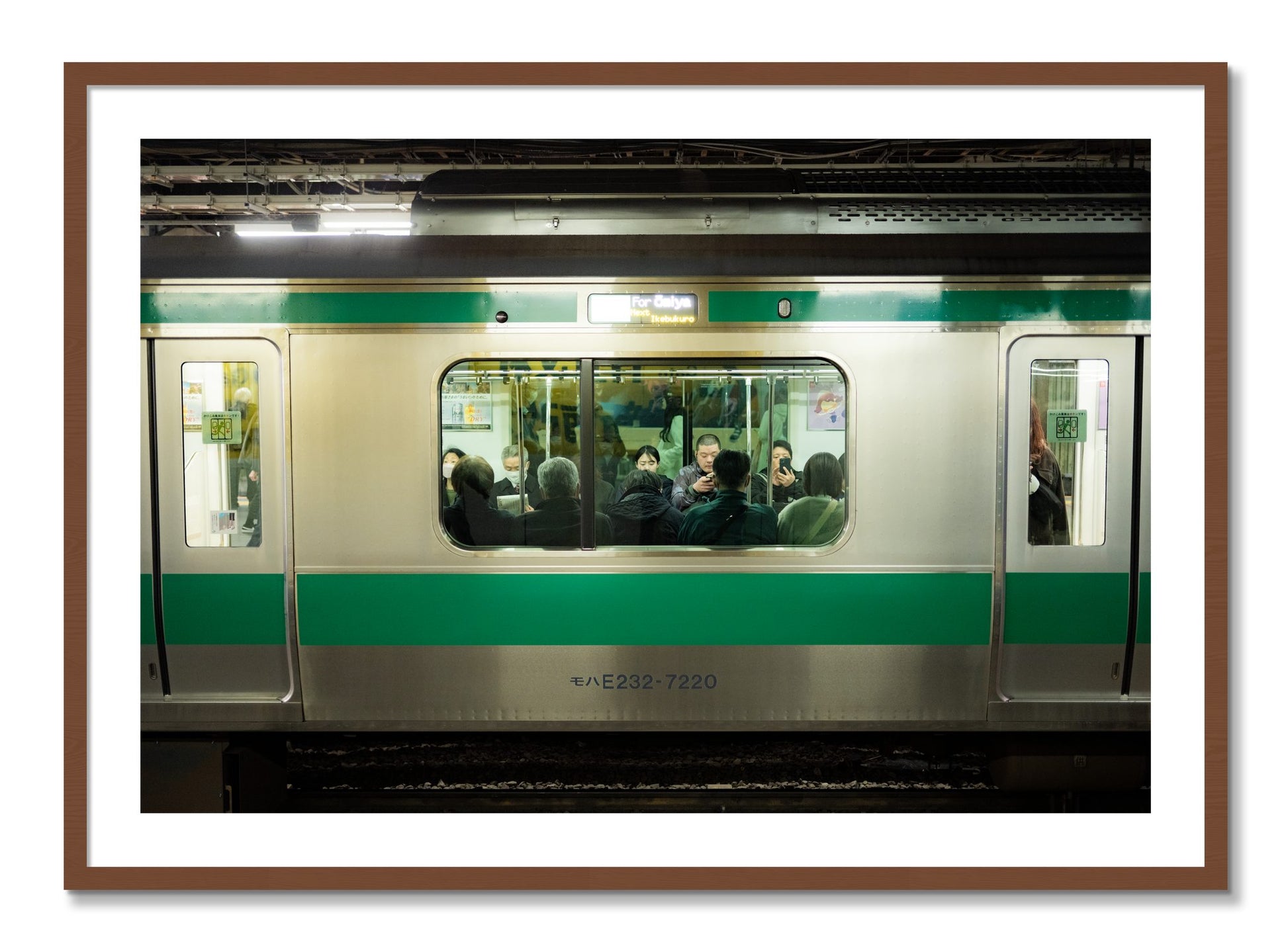 Framed photograph of Commute by Dylan Ozanich, Walnut frame, Borders