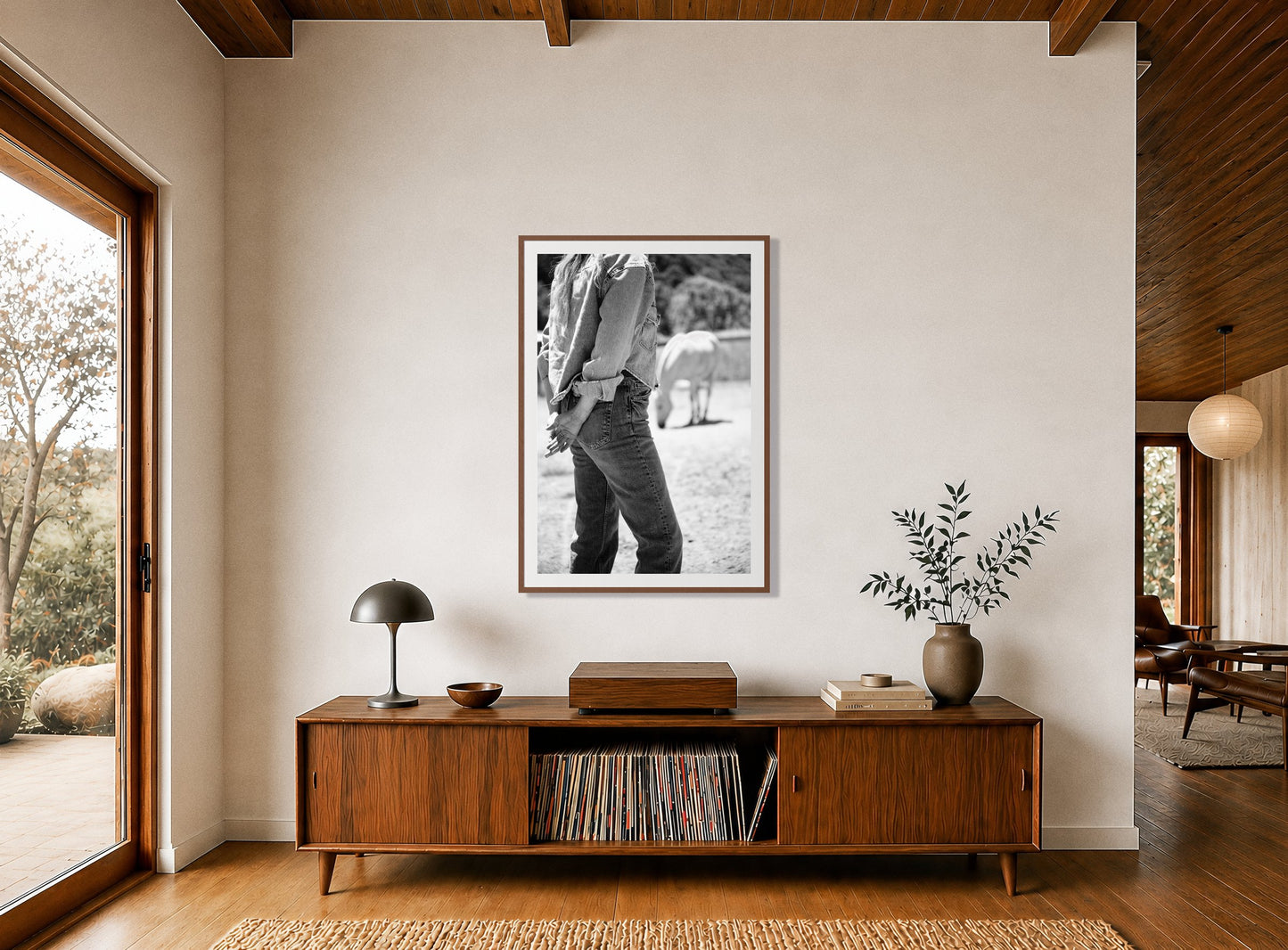 Framed photograph of Cowgirl by Dylan Ozanich displayed on a wall