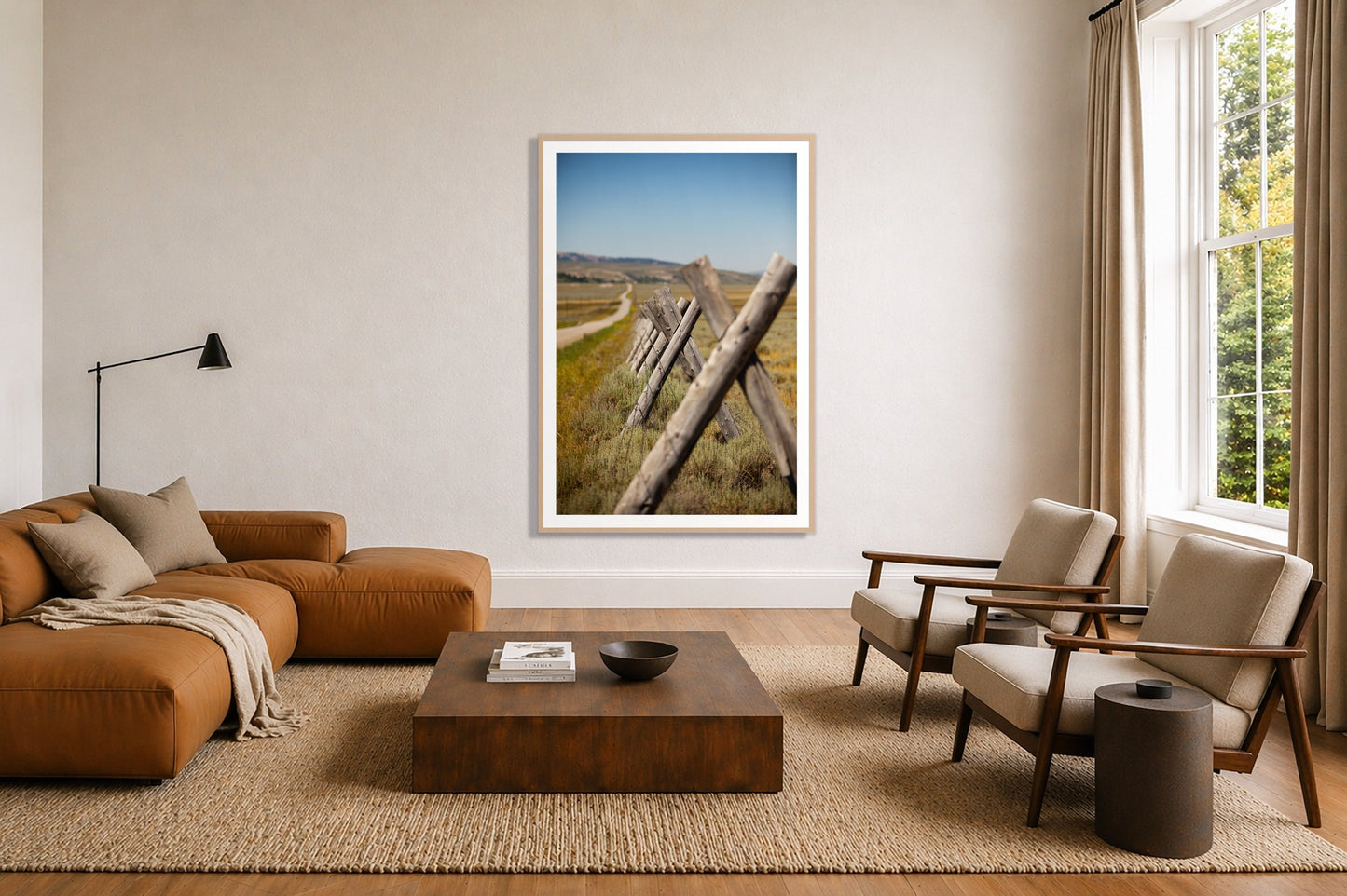Exit Zero by Dylan Ozanich in an Oak frame, above a tan modular leather sofa in a minimal, sunlit living room