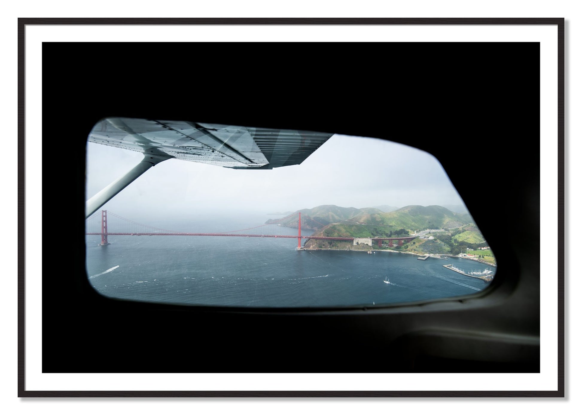 Framed photograph of Flying Over The Gate by Dylan Ozanich, Black Walnut frame, Borders