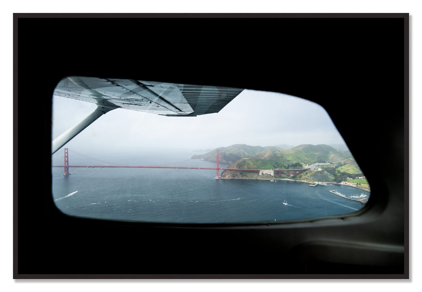 Framed photograph of Flying Over The Gate by Dylan Ozanich, Black Walnut frame, Full Bleed