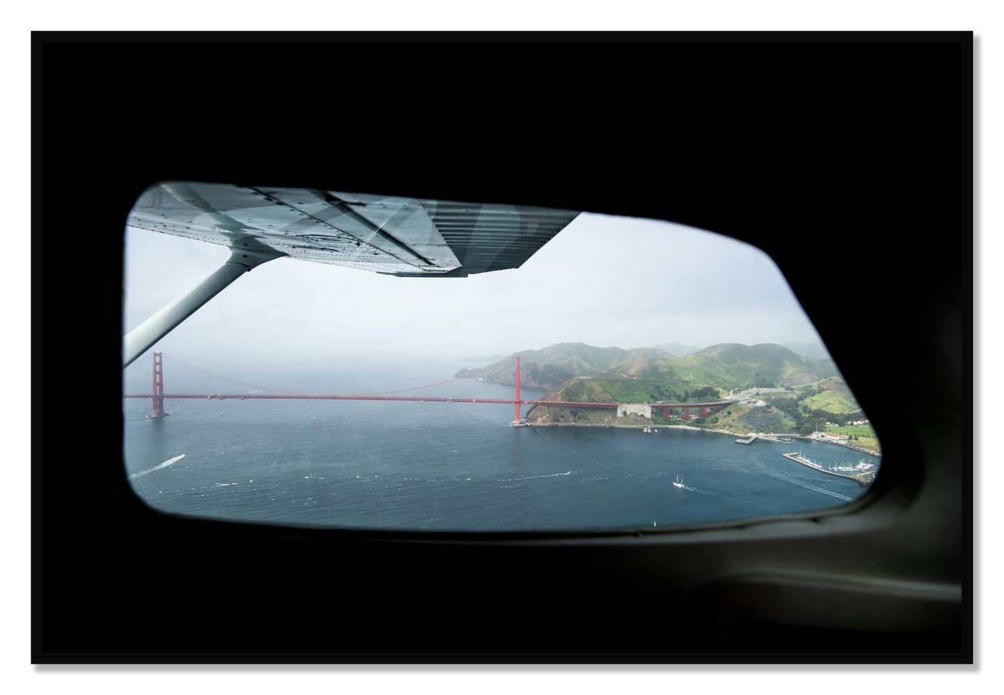 Framed photograph of Flying Over The Gate by Dylan Ozanich, Black frame, Full Bleed