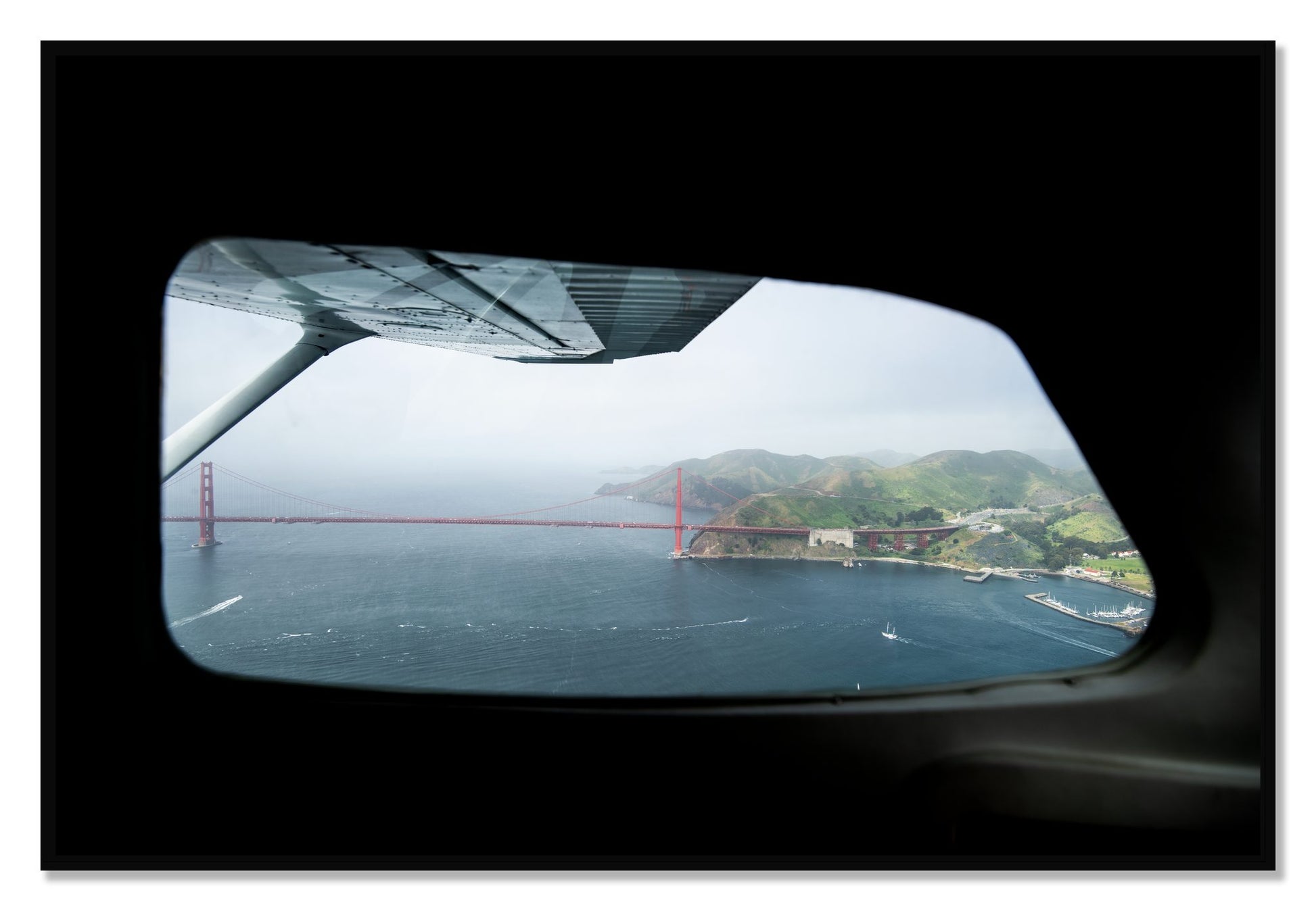Framed photograph of Flying Over The Gate by Dylan Ozanich, Black frame, Full Bleed
