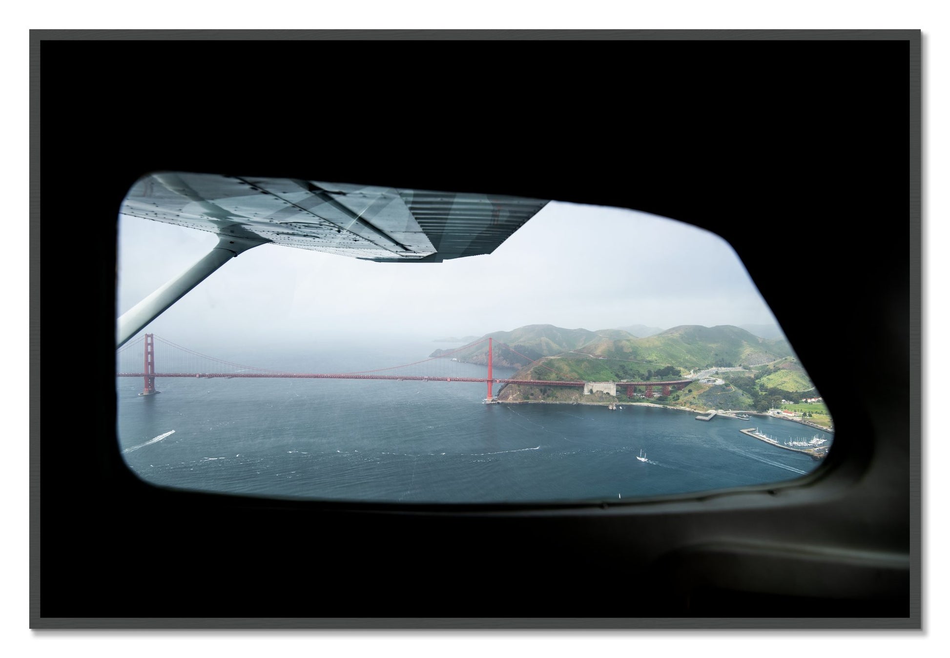Framed photograph of Flying Over The Gate by Dylan Ozanich, Grey frame, Full Bleed