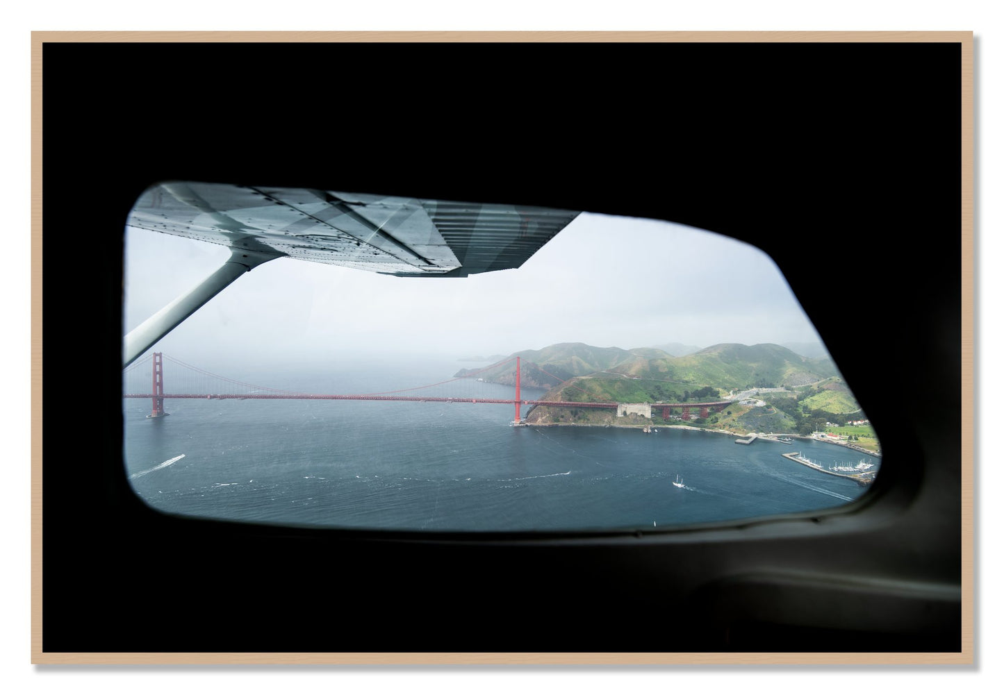 Framed photograph of Flying Over The Gate by Dylan Ozanich, Oak frame, Full Bleed