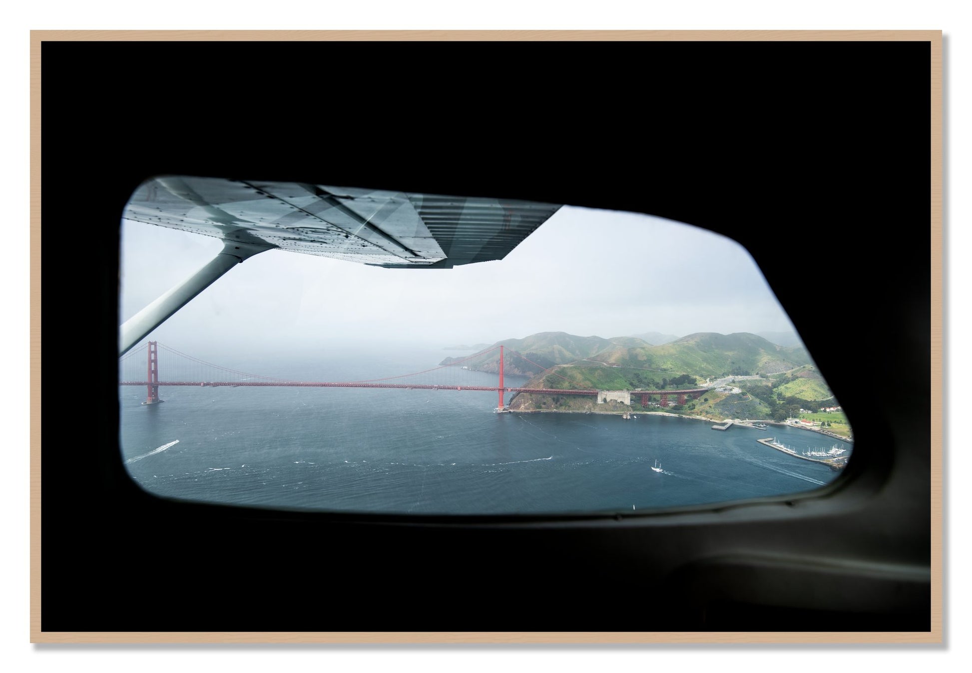 Framed photograph of Flying Over The Gate by Dylan Ozanich, Oak frame, Full Bleed