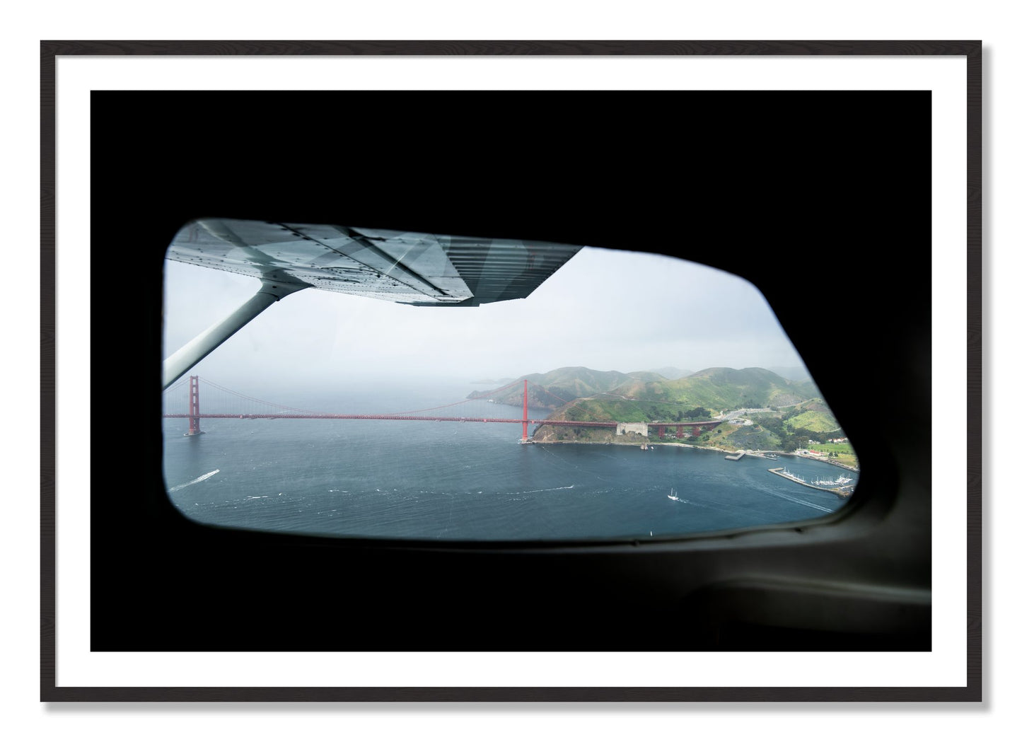 Framed photograph of Flying Over The Gate by Dylan Ozanich, Black Walnut frame, Borders