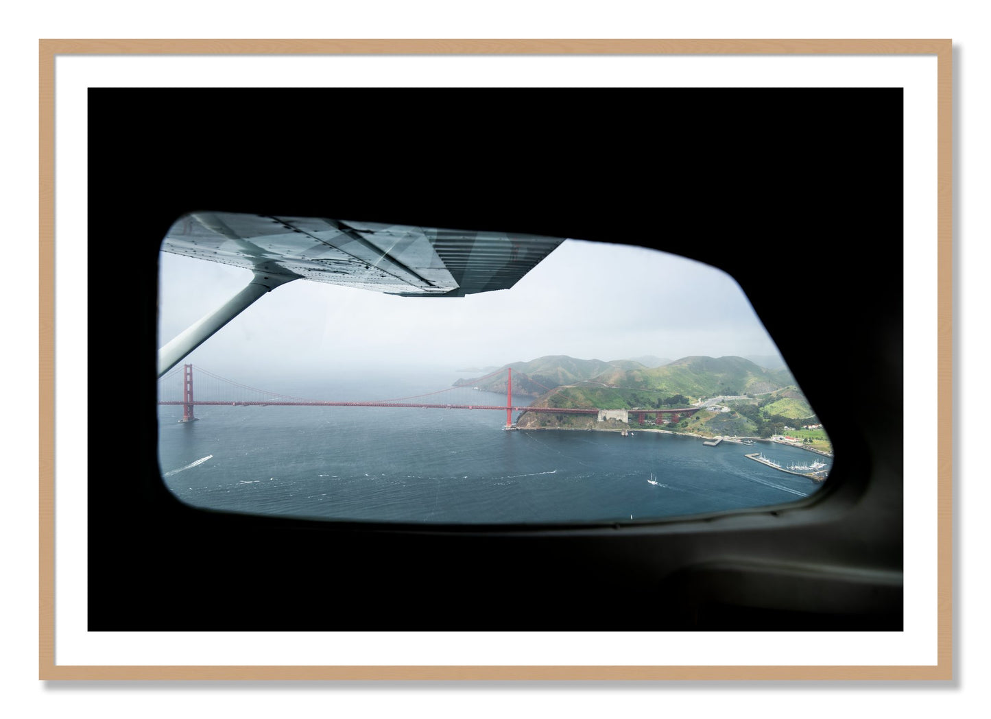 Framed photograph of Flying Over The Gate by Dylan Ozanich, Oak frame, Borders