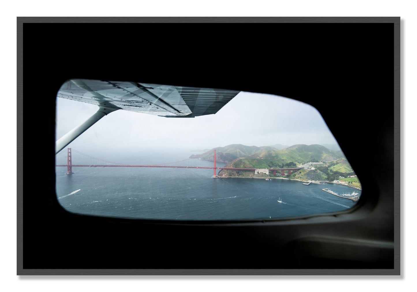 Framed photograph of Flying Over The Gate by Dylan Ozanich, Grey frame, Full Bleed