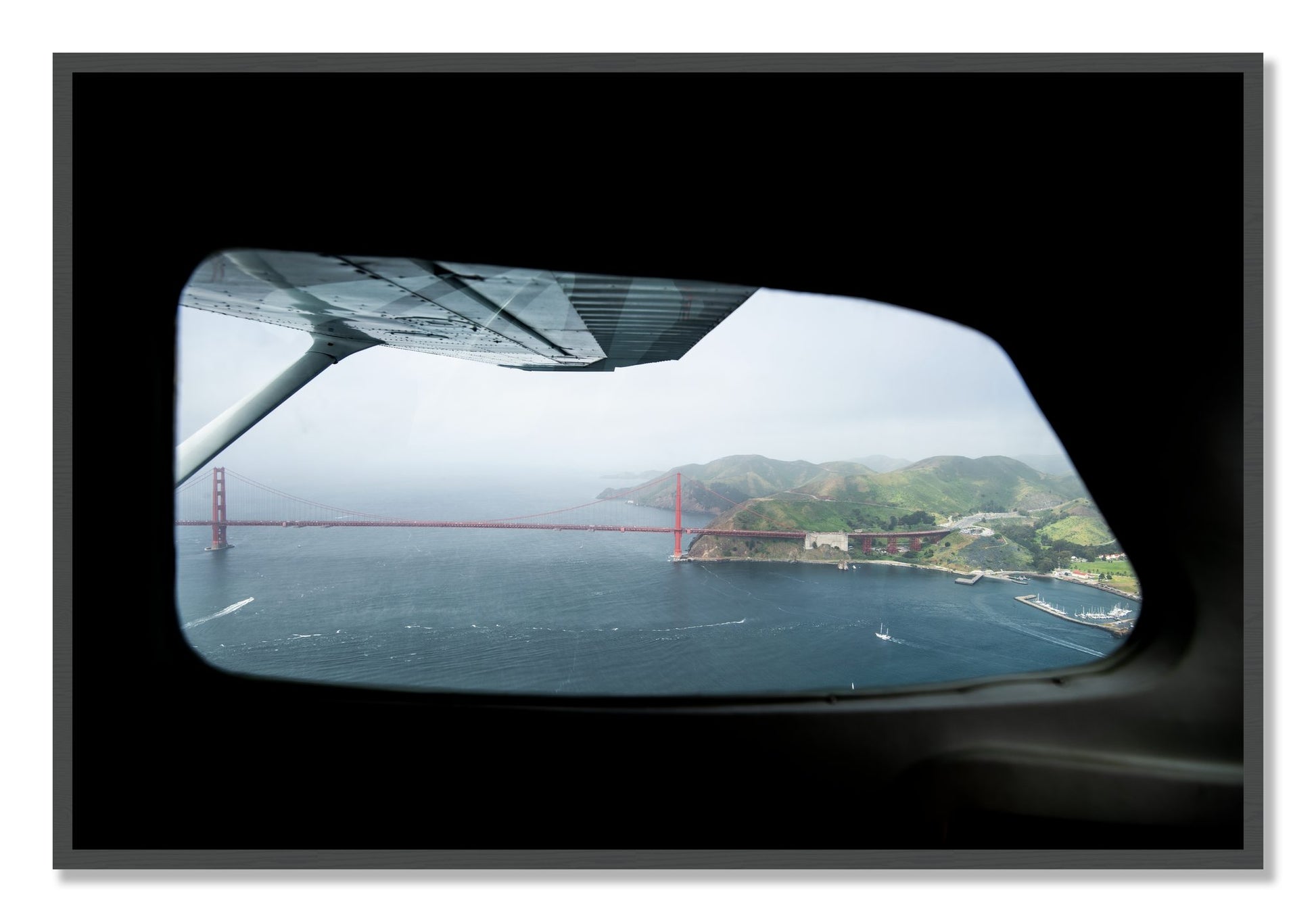 Framed photograph of Flying Over The Gate by Dylan Ozanich, Grey frame, Full Bleed