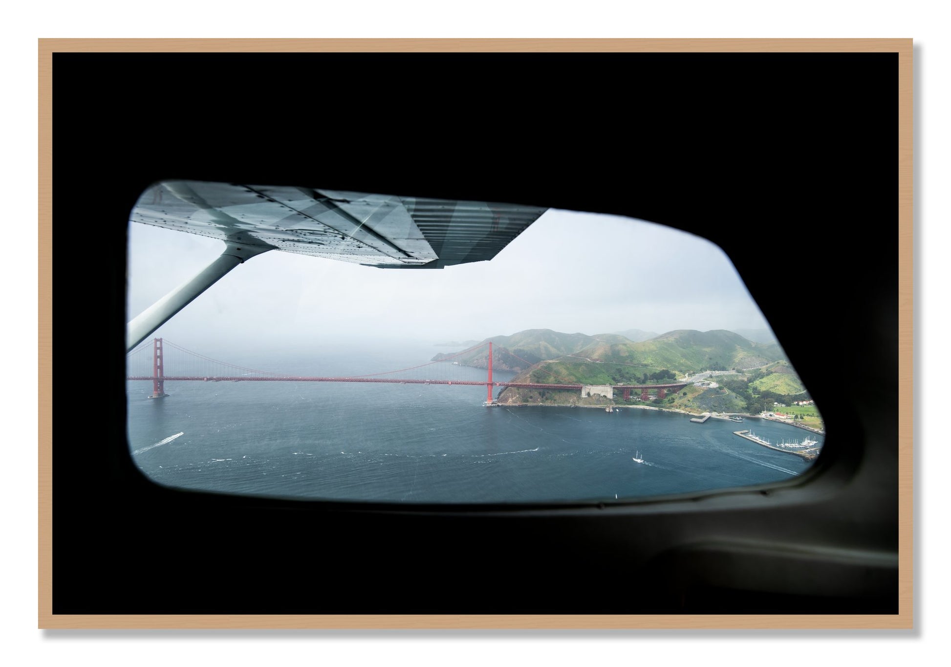 Framed photograph of Flying Over The Gate by Dylan Ozanich, Oak frame, Full Bleed