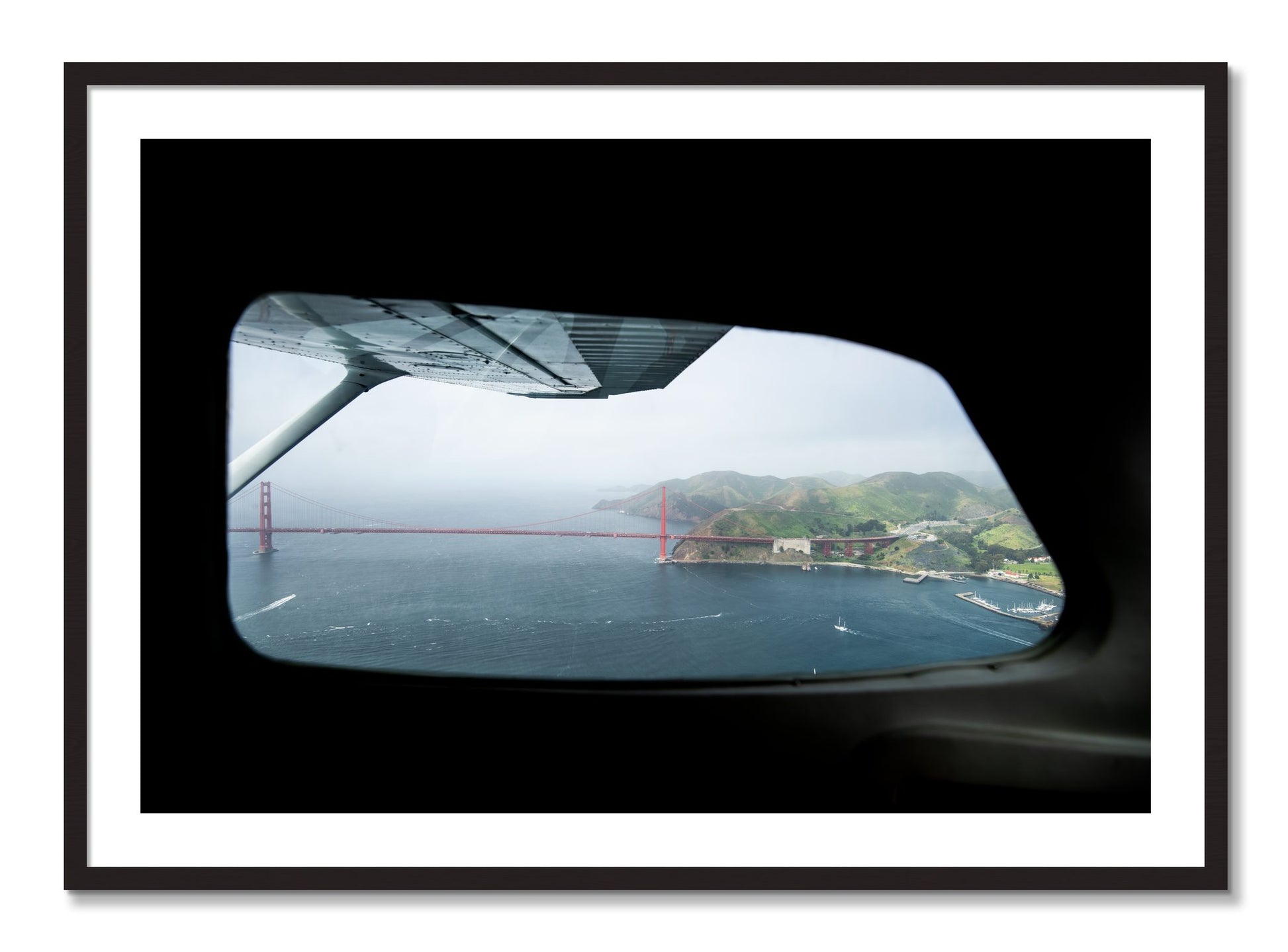 Framed photograph of Flying Over The Gate by Dylan Ozanich, Black Walnut frame, Borders