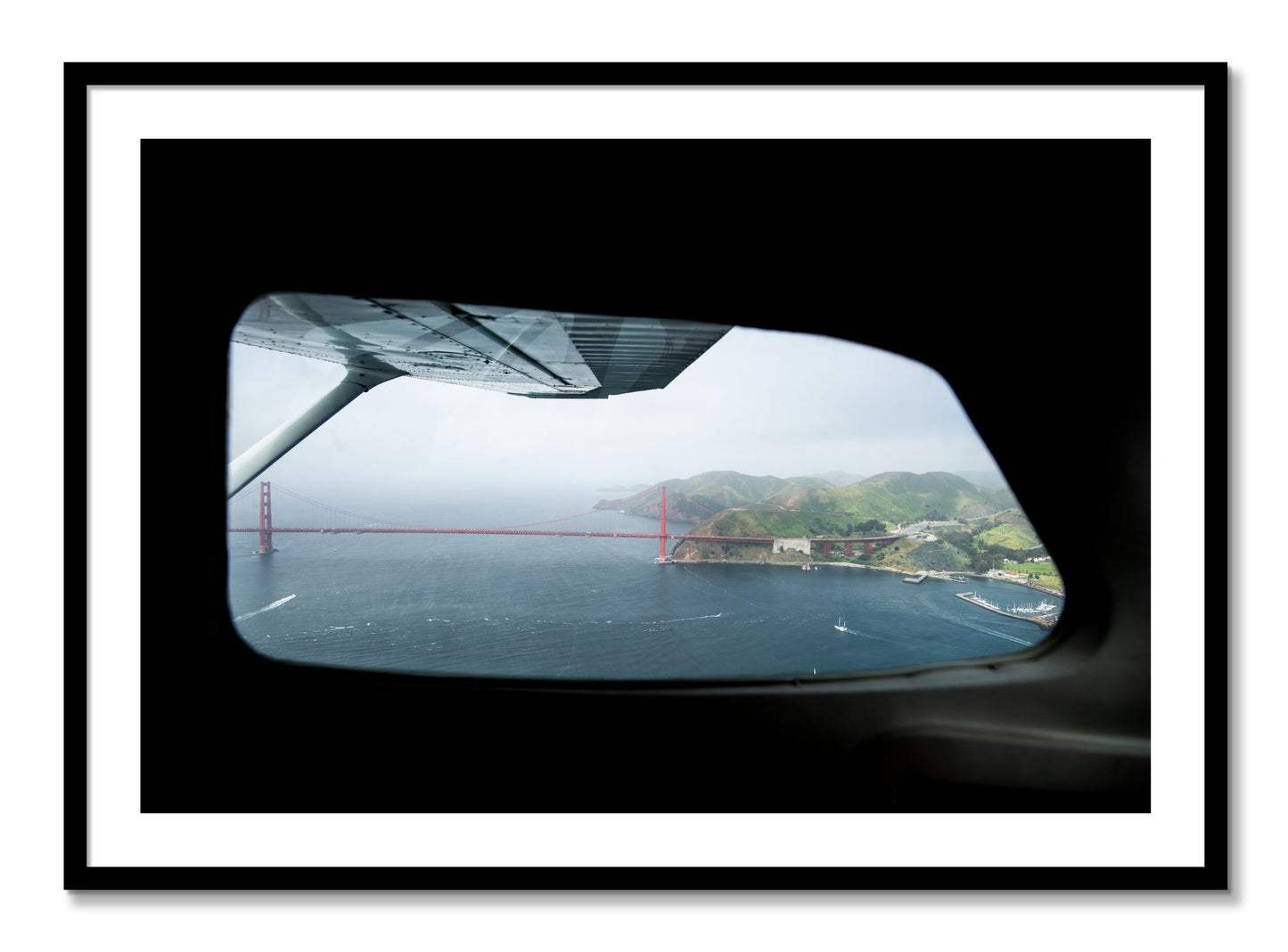 Framed photograph of Flying Over The Gate by Dylan Ozanich, Black frame, Borders
