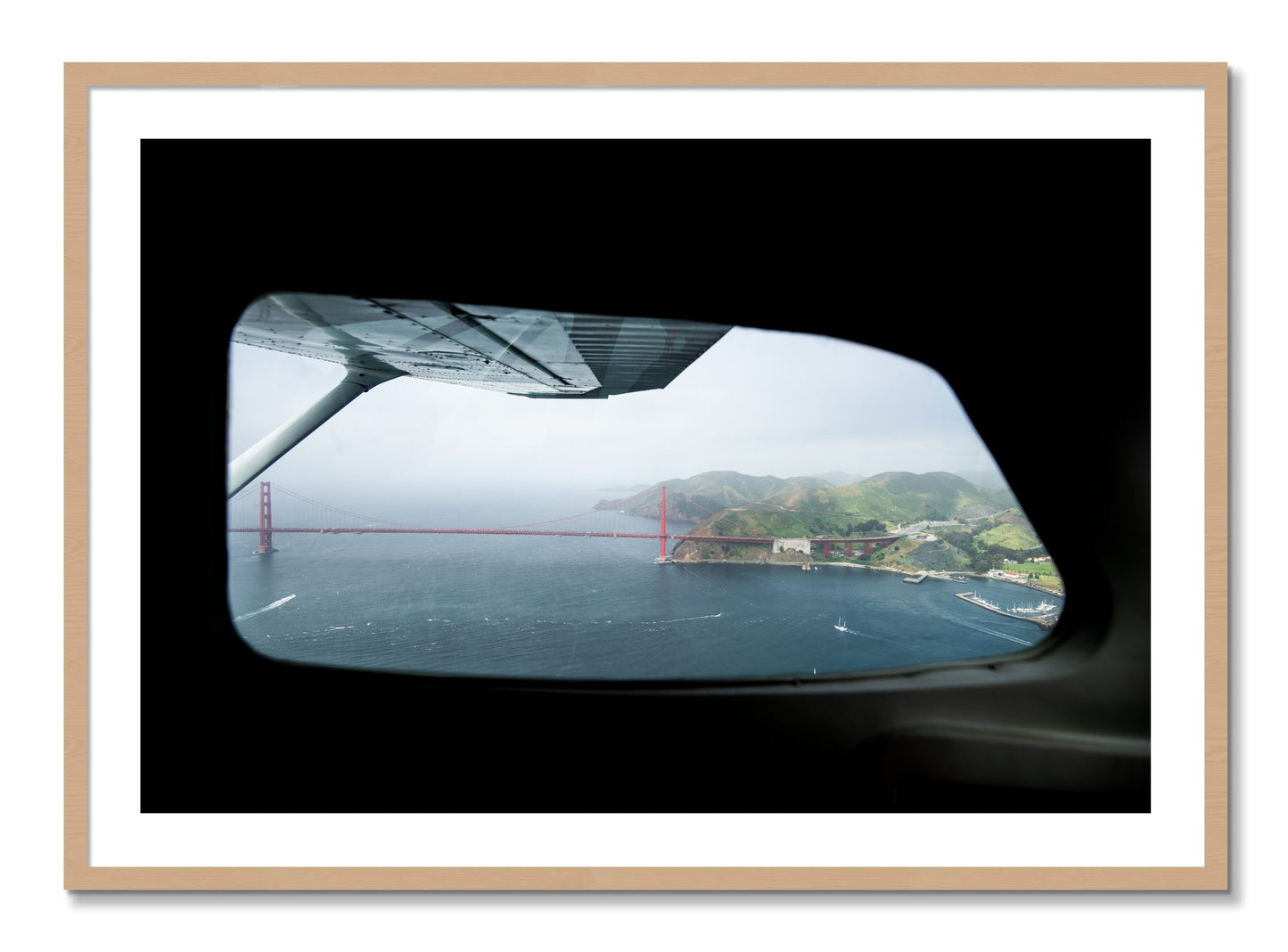 Framed photograph of Flying Over The Gate by Dylan Ozanich, Oak frame, Borders