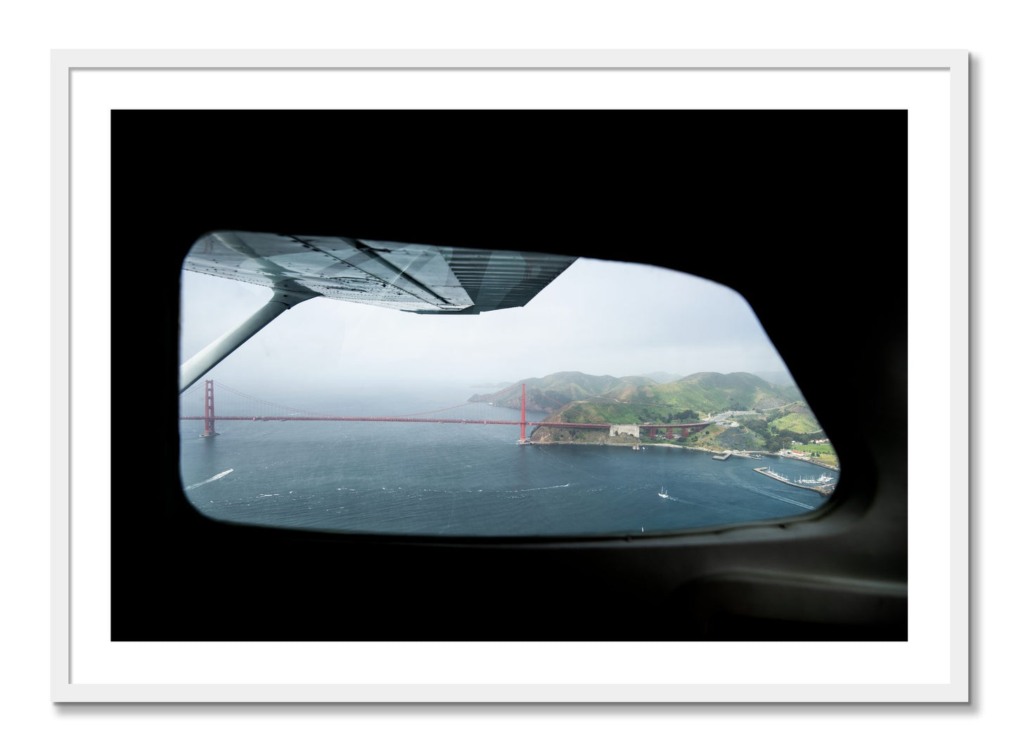 Framed photograph of Flying Over The Gate by Dylan Ozanich, White frame, Borders