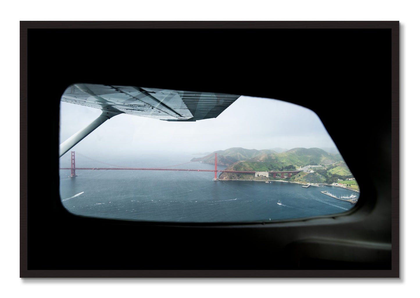 Framed photograph of Flying Over The Gate by Dylan Ozanich, Black Walnut frame, Full Bleed