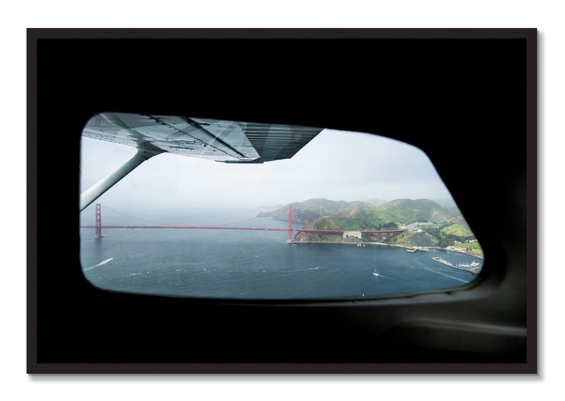 Framed photograph of Flying Over The Gate by Dylan Ozanich, Black Walnut frame, Full Bleed