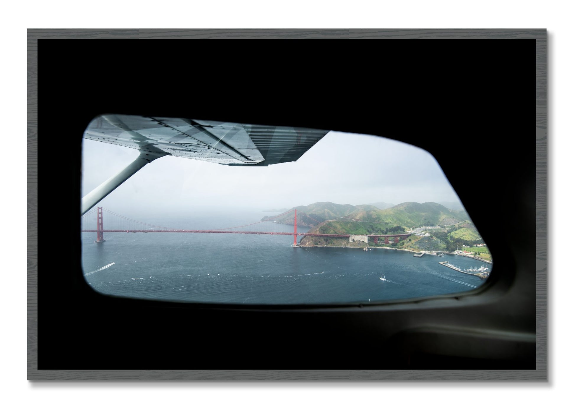 Framed photograph of Flying Over The Gate by Dylan Ozanich, Grey frame, Full Bleed
