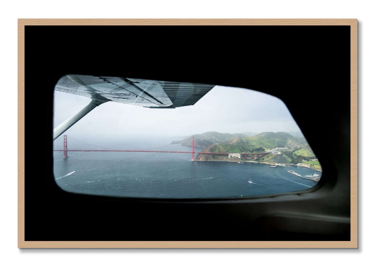 Framed photograph of Flying Over The Gate by Dylan Ozanich, Oak frame, Full Bleed